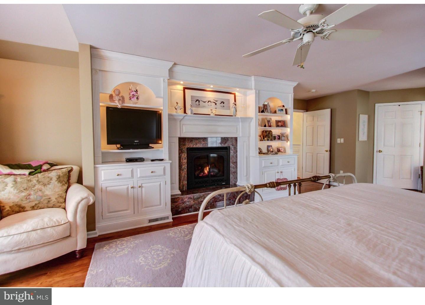 5237 Windtree Drive Doylestown, PA 18902 - Photo 15 of 25 a bedroom with a bed and a flat screen tv