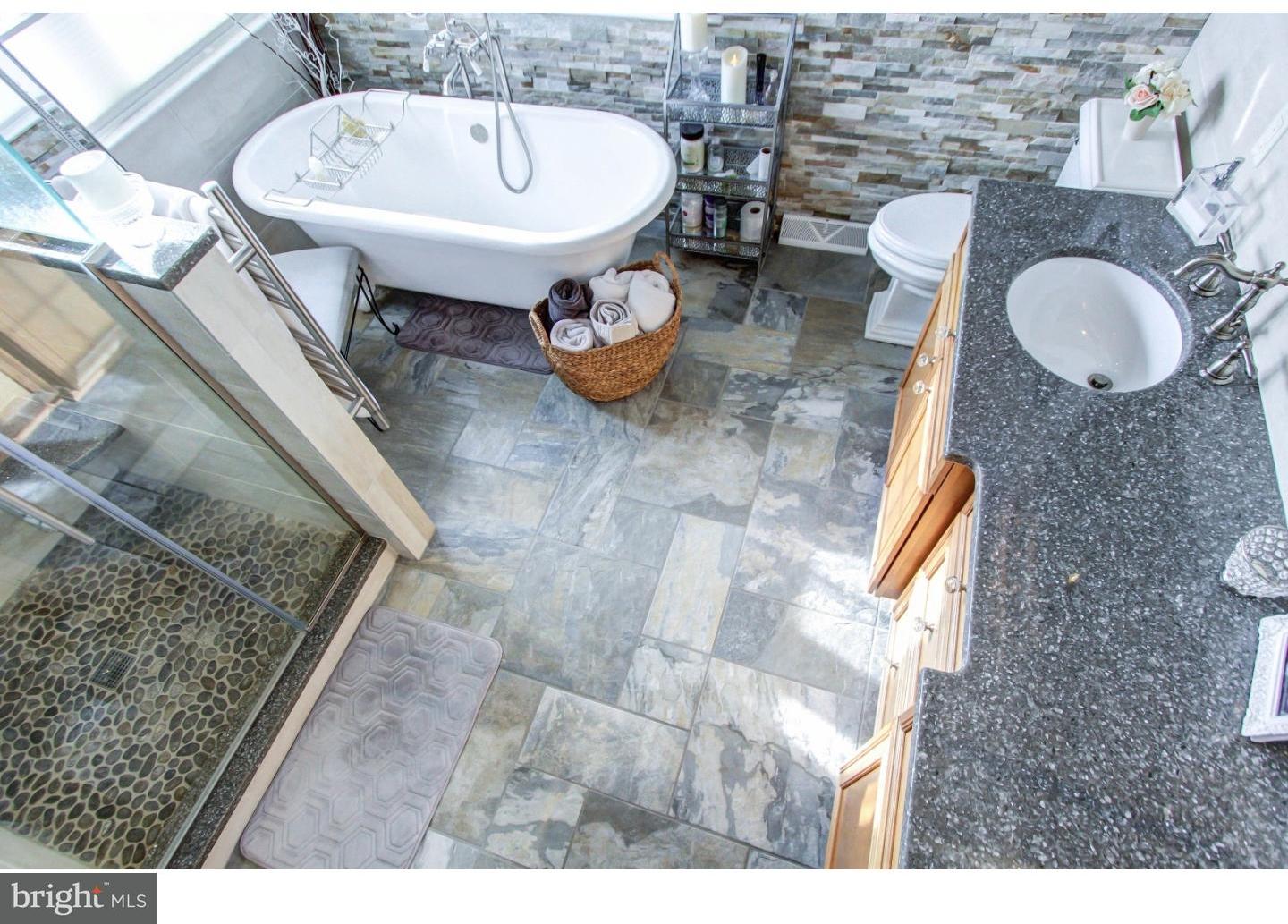 5237 Windtree Drive Doylestown, PA 18902 - Photo 16 of 25 a bathroom with a sink mirror and toilet