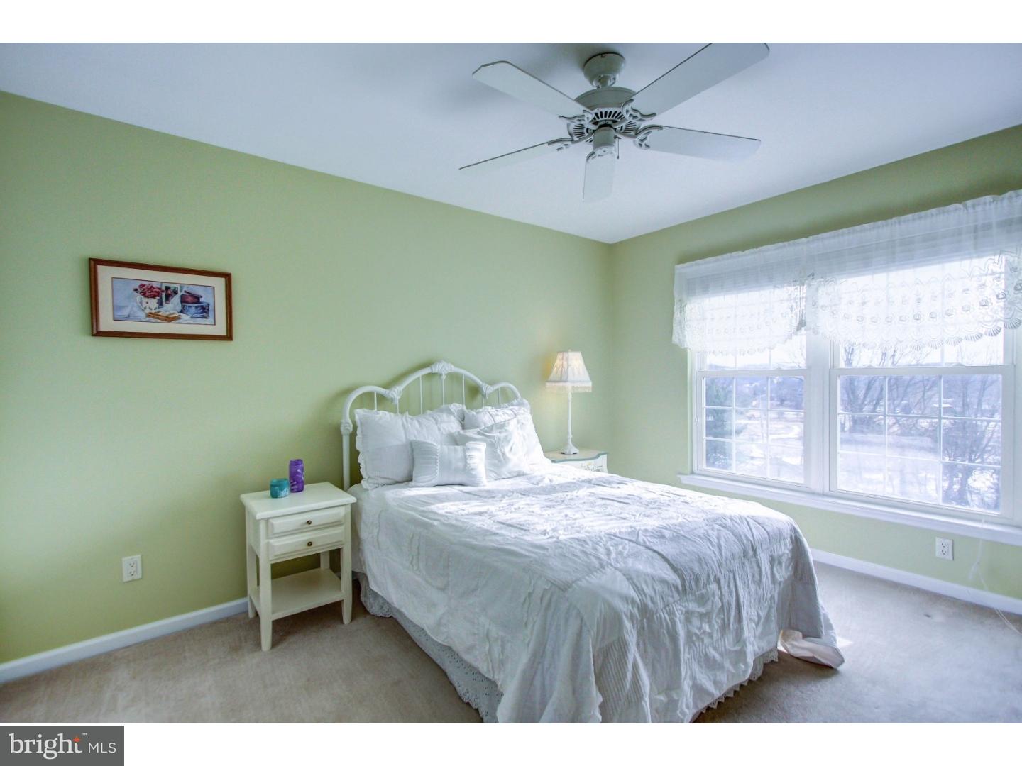 5237 Windtree Drive Doylestown, PA 18902 - Photo 20 of 25 a bedroom with a bed and a window