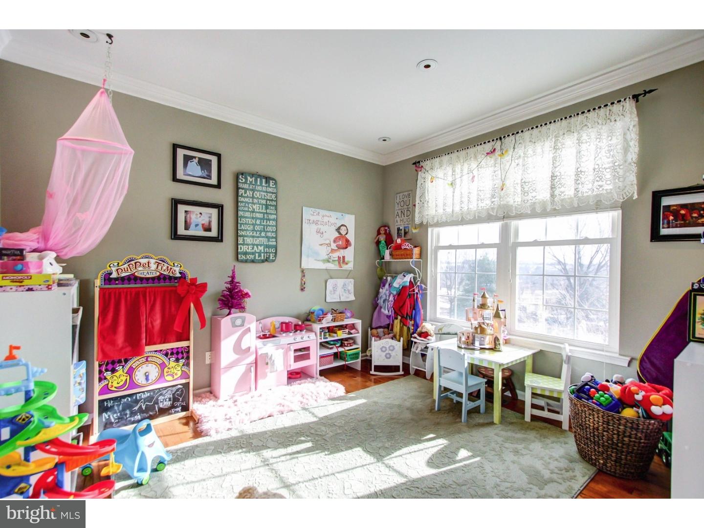 5237 Windtree Drive Doylestown, PA 18902 - Photo 6 of 25 a living room with furniture and a floor to ceiling window