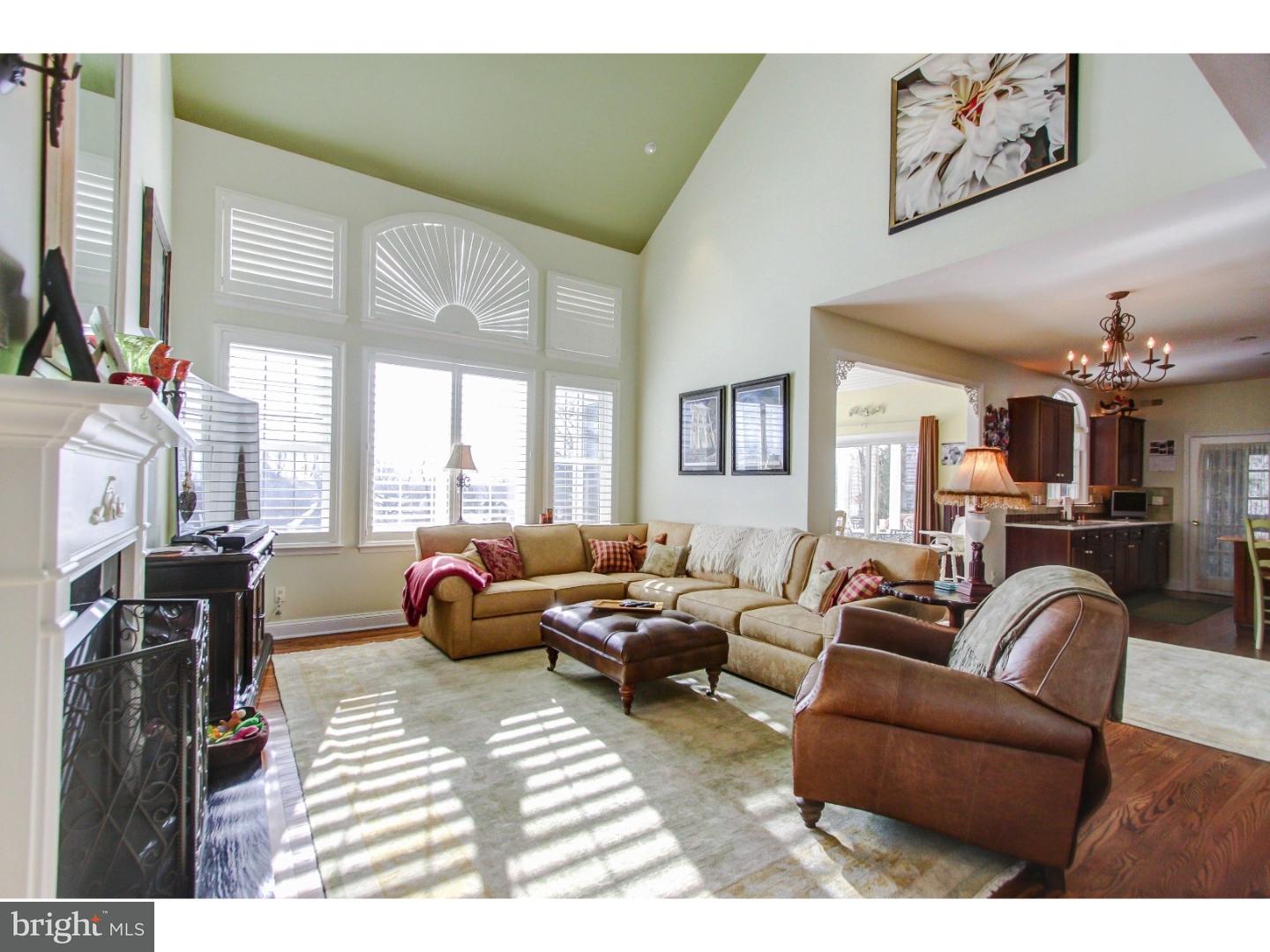 5237 Windtree Drive Doylestown, PA 18902 - Photo 8 of 25 a living room with furniture large window and flat screen tv