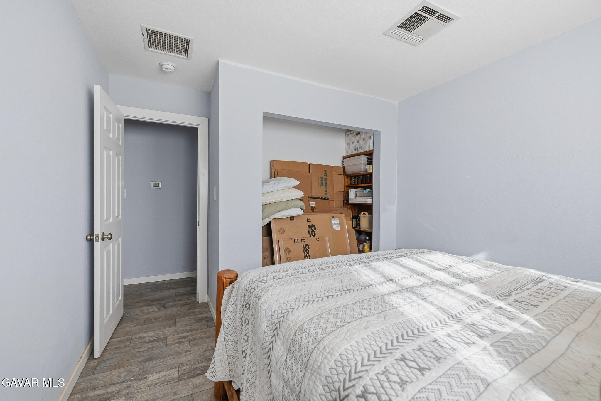 10817 East Ave R 12 Littlerock, CA 93543 - Photo 20 of 43 a bedroom with a bed and a mirror