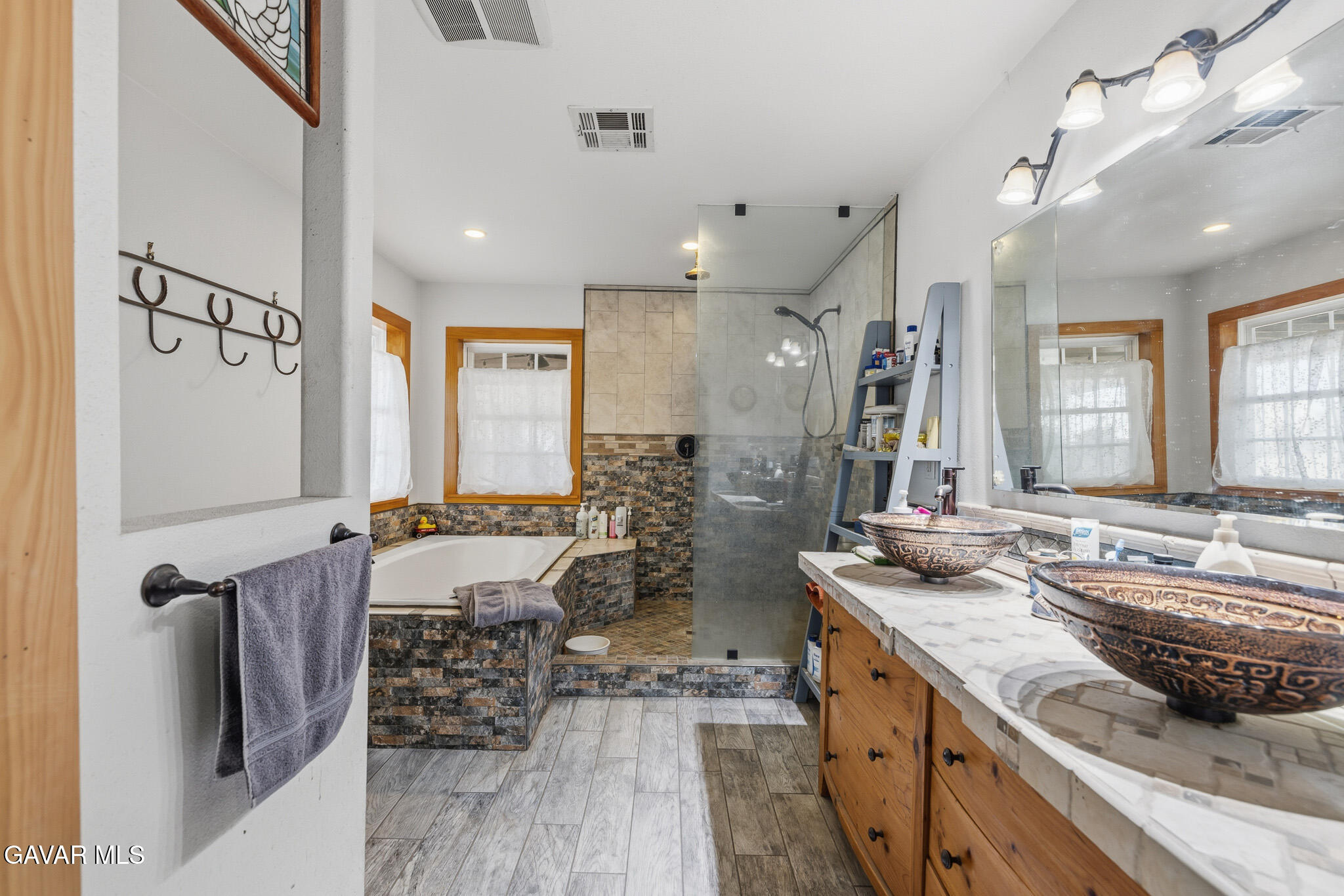 10817 East Ave R 12 Littlerock, CA 93543 - Photo 23 of 43 a spacious bathroom with sinks mirror and a shower