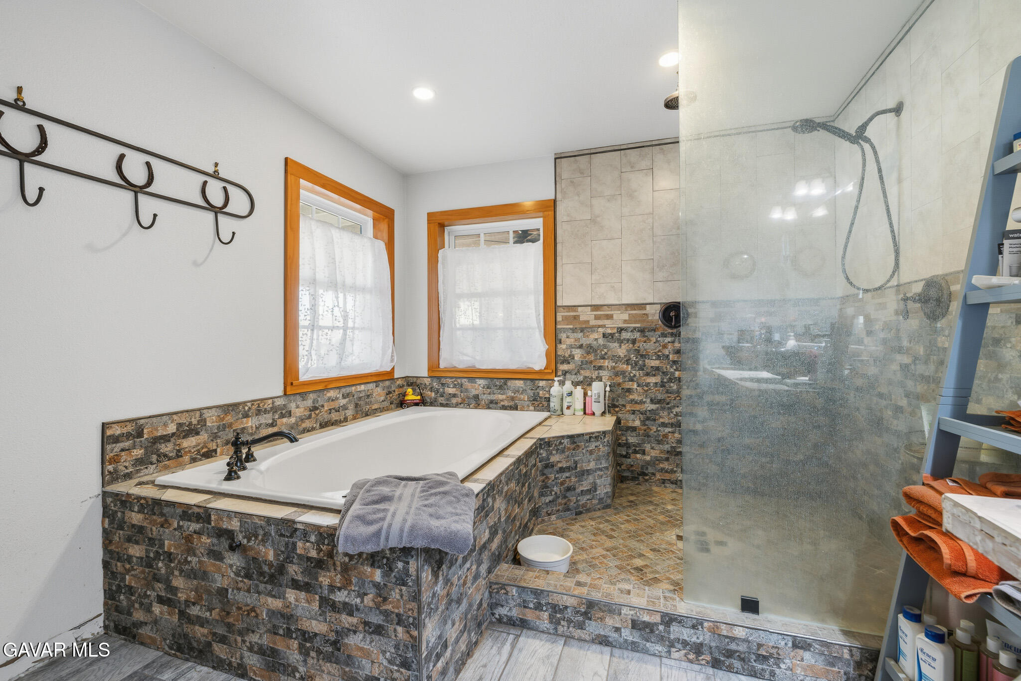 10817 East Ave R 12 Littlerock, CA 93543 - Photo 24 of 43 a bathroom with a granite countertop sink a bathtub and shower