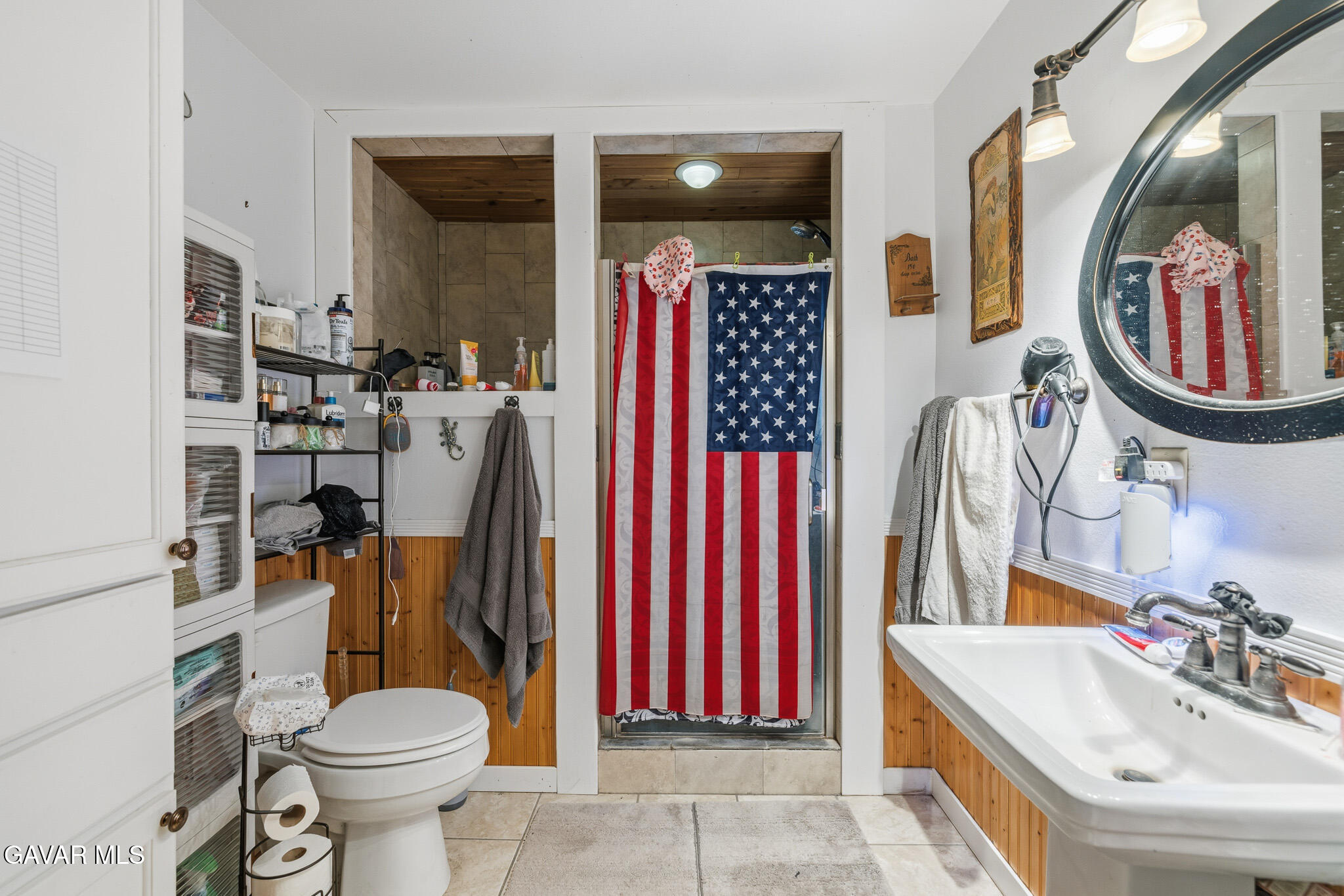 10817 East Ave R 12 Littlerock, CA 93543 - Photo 28 of 43 a bathroom with a sink mirror vanity and toilet