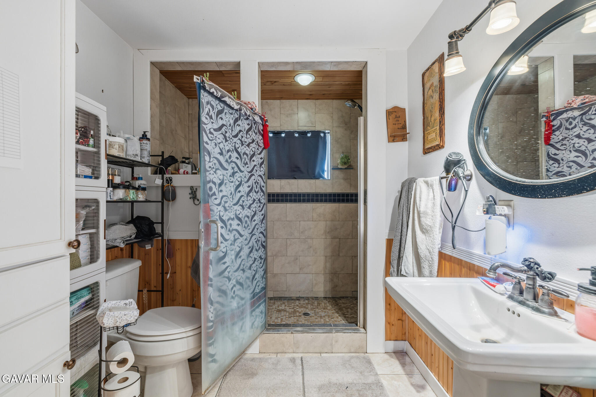 10817 East Ave R 12 Littlerock, CA 93543 - Photo 29 of 43 a bathroom with a sink toilet and shower