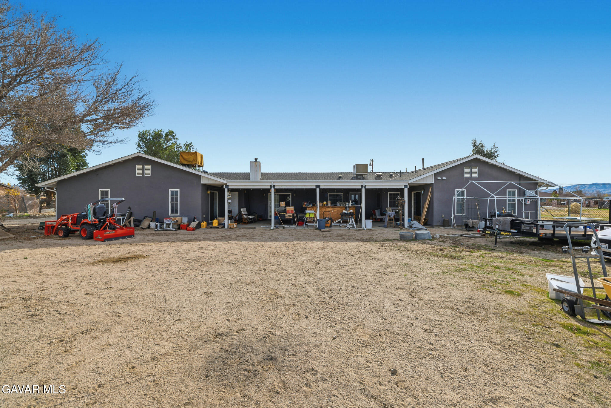 10817 East Ave R 12 Littlerock, CA 93543 - Photo 31 of 43 a front view of a house with a yard