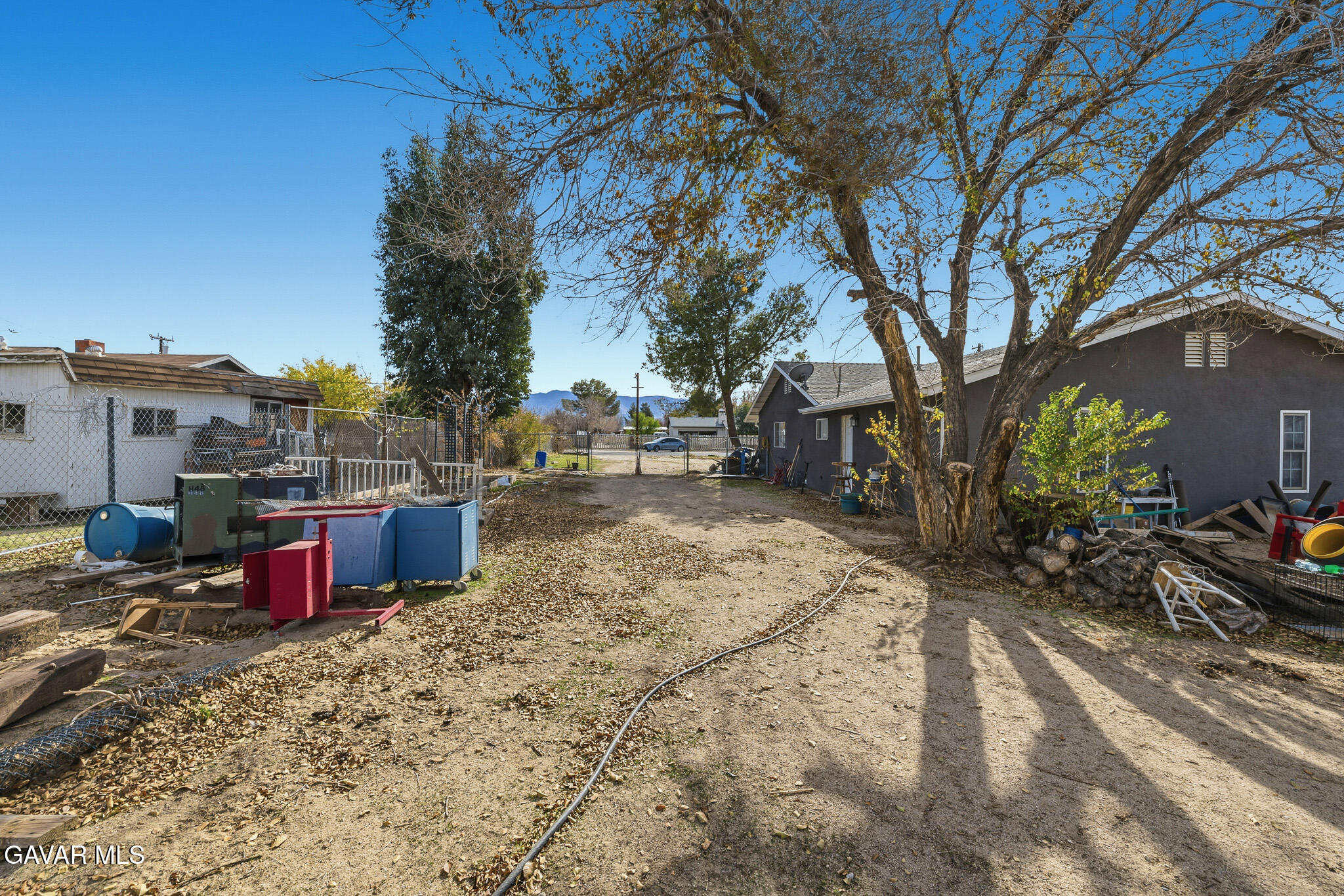 10817 East Ave R 12 Littlerock, CA 93543 - Photo 37 of 43 a view of a backyard with a large tree