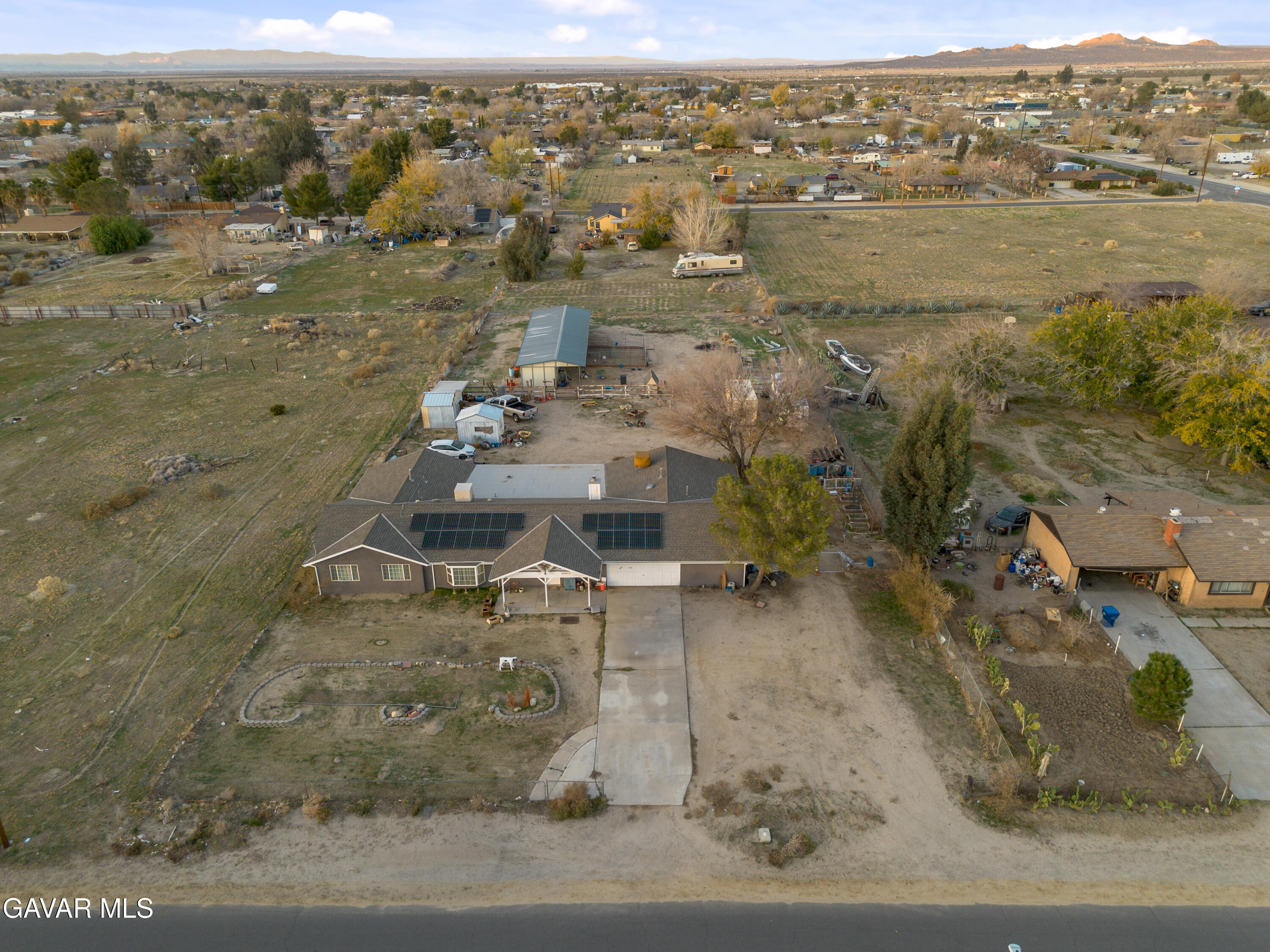 10817 East Ave R 12 Littlerock, CA 93543 - Photo 38 of 43 an aerial view of residential houses with outdoor space