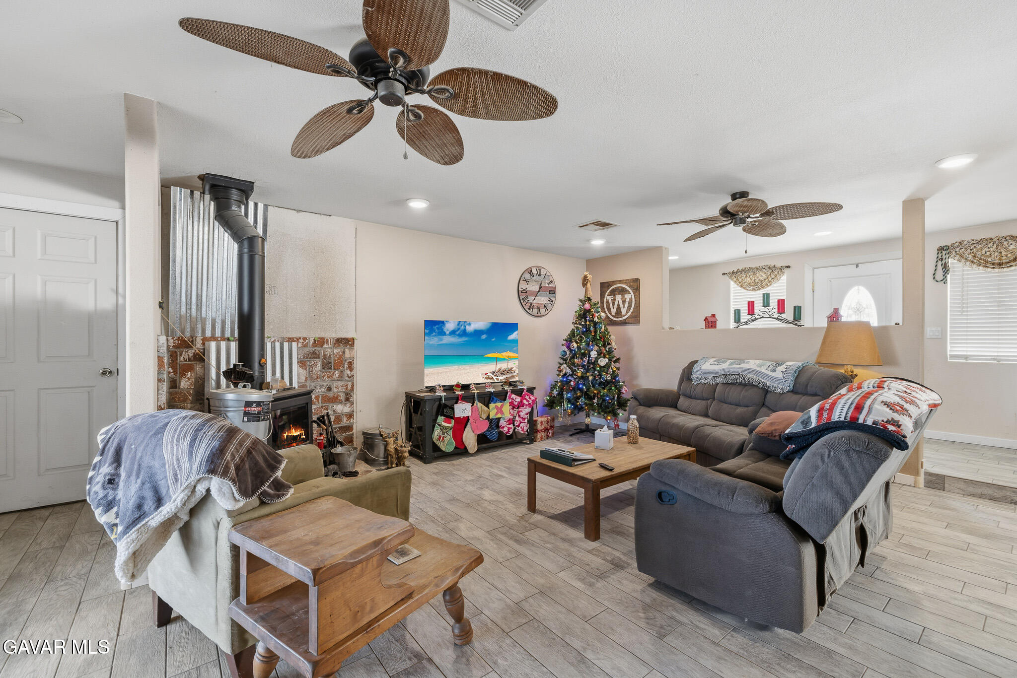 10817 East Ave R 12 Littlerock, CA 93543 - Photo 7 of 43 a living room with furniture ceiling fan and a rug