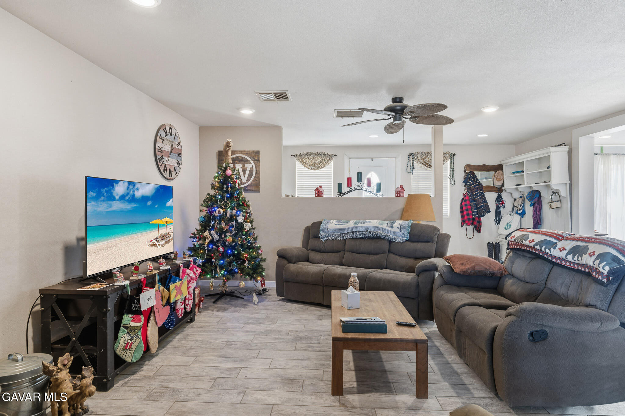 10817 East Ave R 12 Littlerock, CA 93543 - Photo 8 of 43 a living room with furniture and a flat screen tv