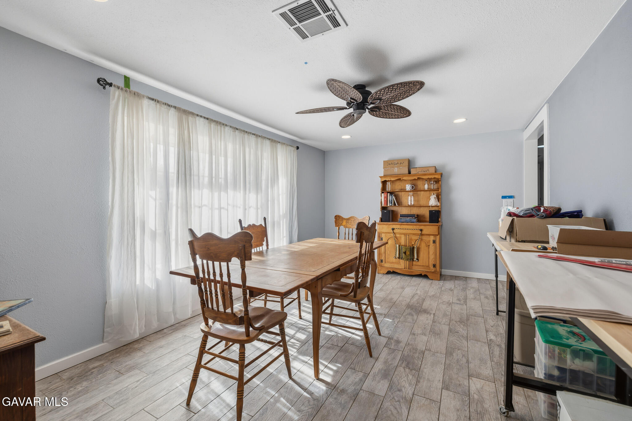10817 East Ave R 12 Littlerock, CA 93543 - Photo 9 of 43 a view of a dining room with furniture and a window