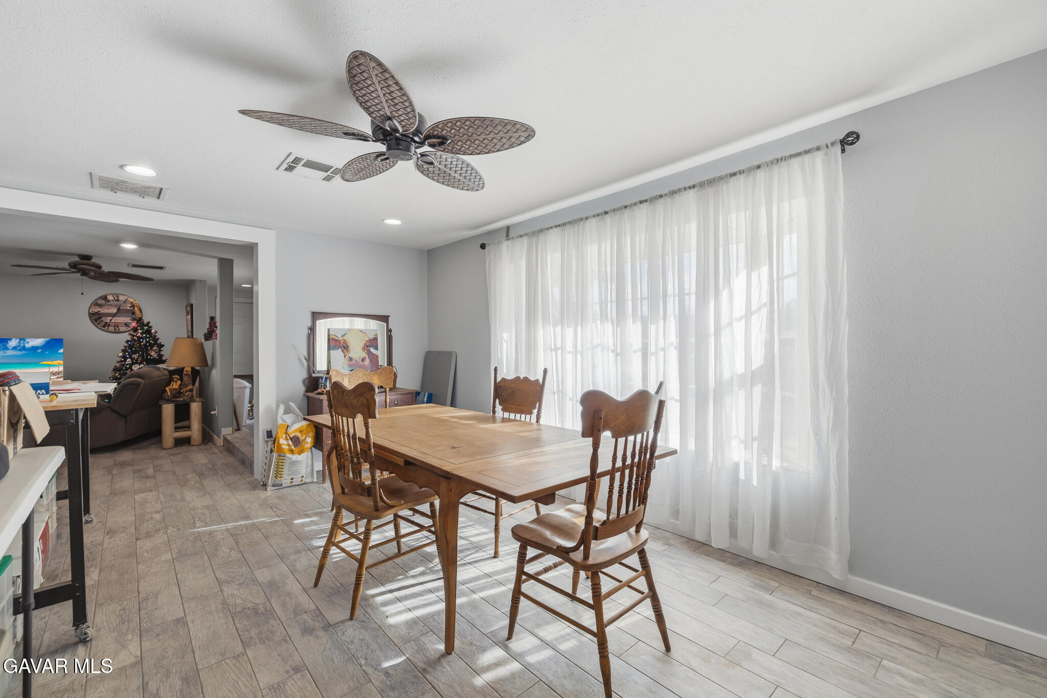 10817 East Ave R 12 Littlerock, CA 93543 - Photo 10 of 43 a view of a dining room with furniture and window