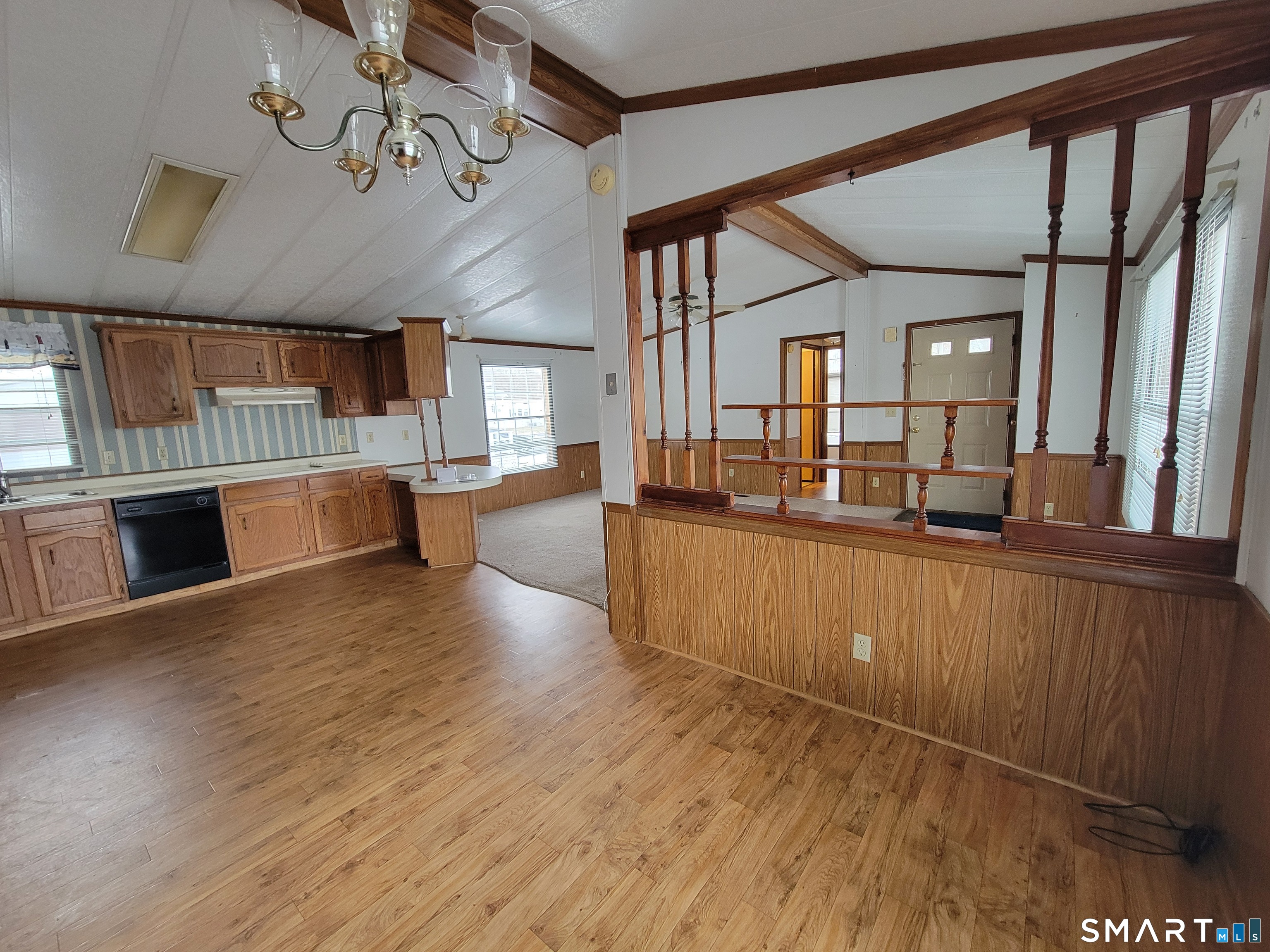 172 D Street Groton, CT 06340 - Photo 6 of 11 a view of a living room and kitchen with furniture wooden floor and a view