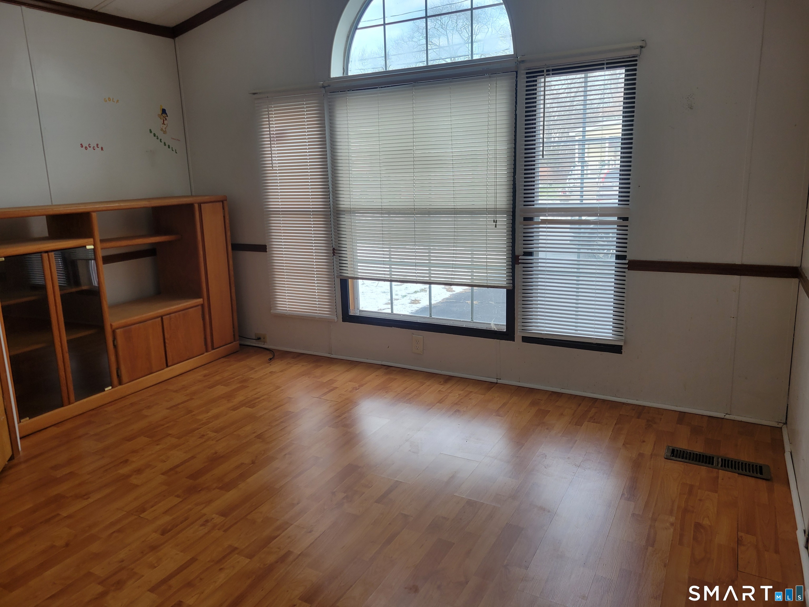 172 D Street Groton, CT 06340 - Photo 10 of 11 an empty room with wooden floor and windows