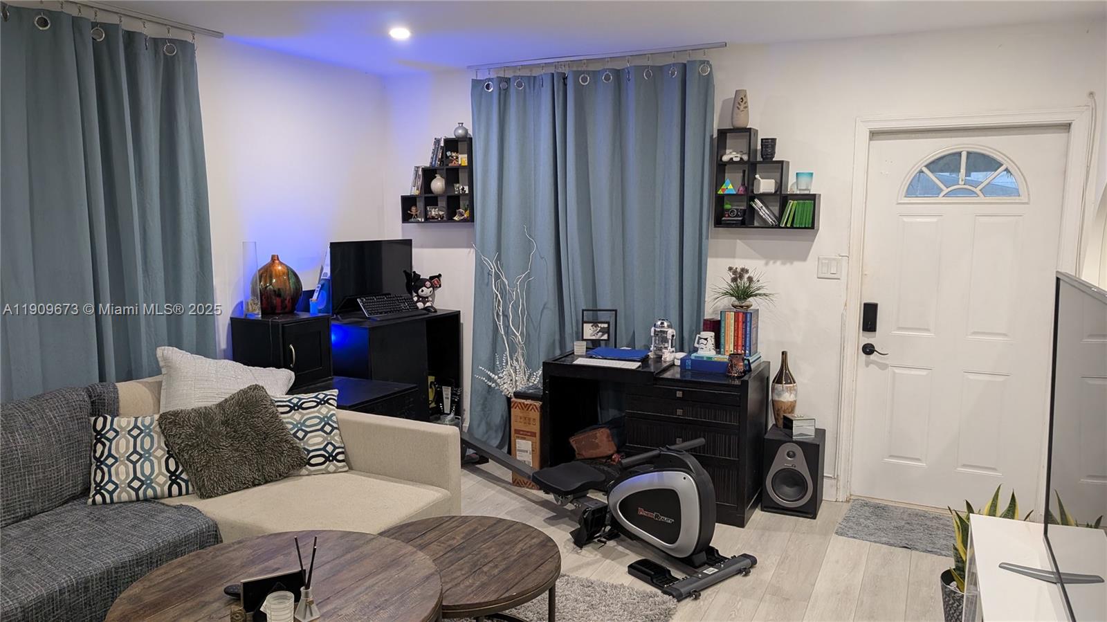 917-919 Northeast 10th Street Hallandale Beach, FL 33009 - Photo 2 of 10 a bedroom with a workspace