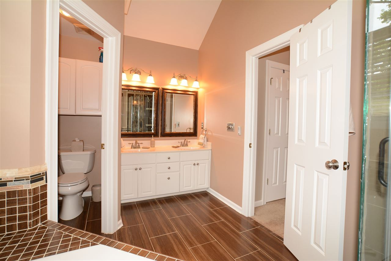 5801 Valley Mist Court Raleigh, NC 27613 - Photo 17 of 25 Bath features a Dual Vanity with Decorative Mirrors, Tiled Flooring & separate Water Closet. Master Bath