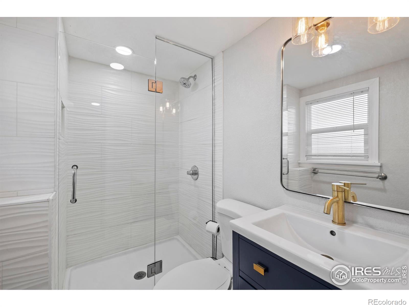814 West Laurel Street Fort Collins, CO 80521 - Photo 19 of 35 a bathroom with a sink and a shower