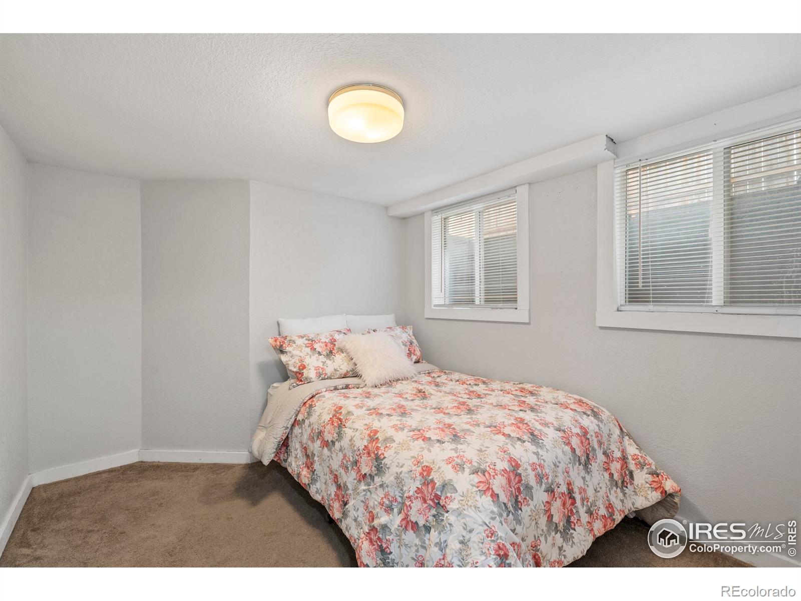 814 West Laurel Street Fort Collins, CO 80521 - Photo 23 of 35 a bedroom with a bed and a window