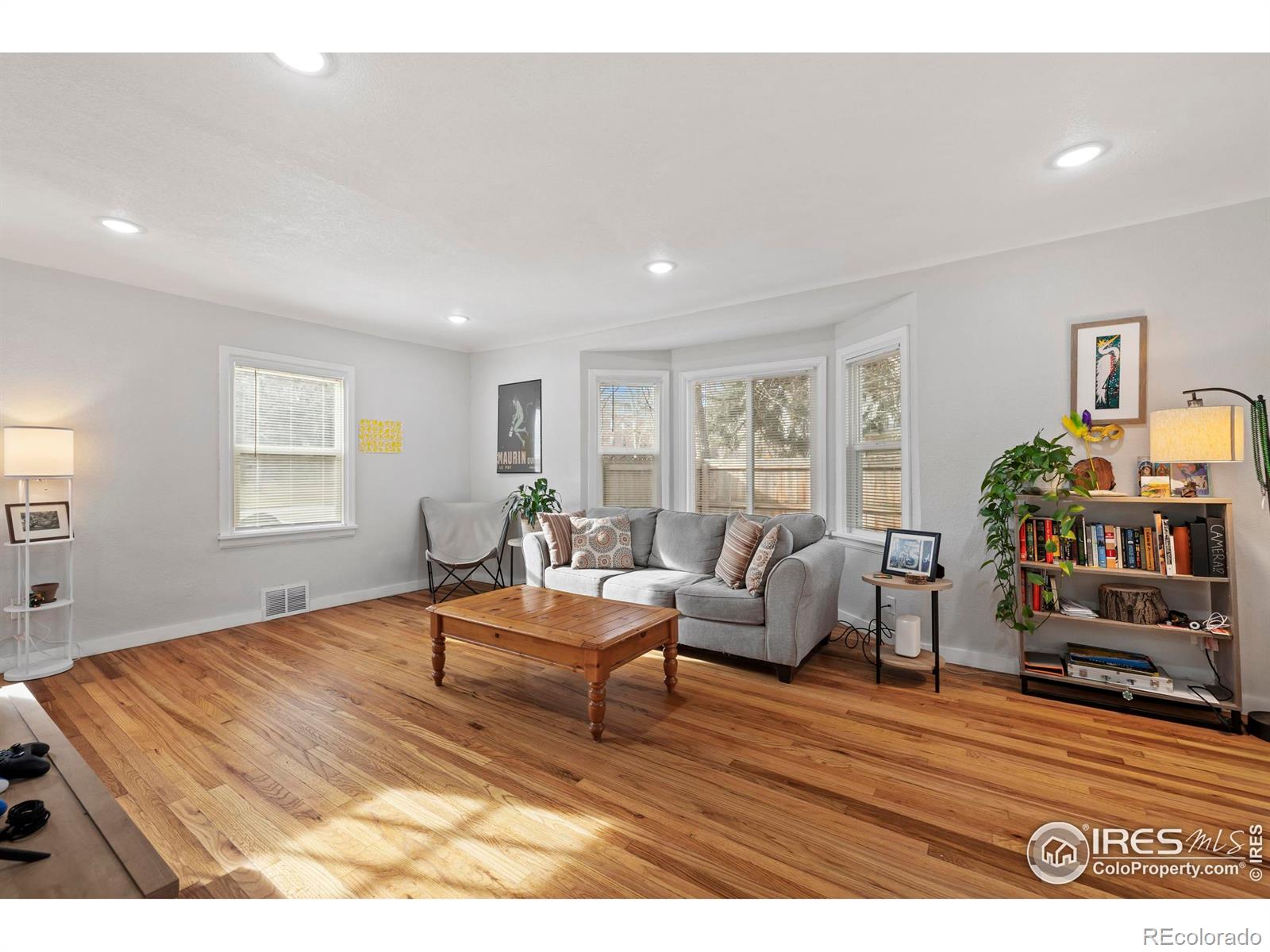 814 West Laurel Street Fort Collins, CO 80521 - Photo 8 of 35 a living room with furniture and a wooden floor