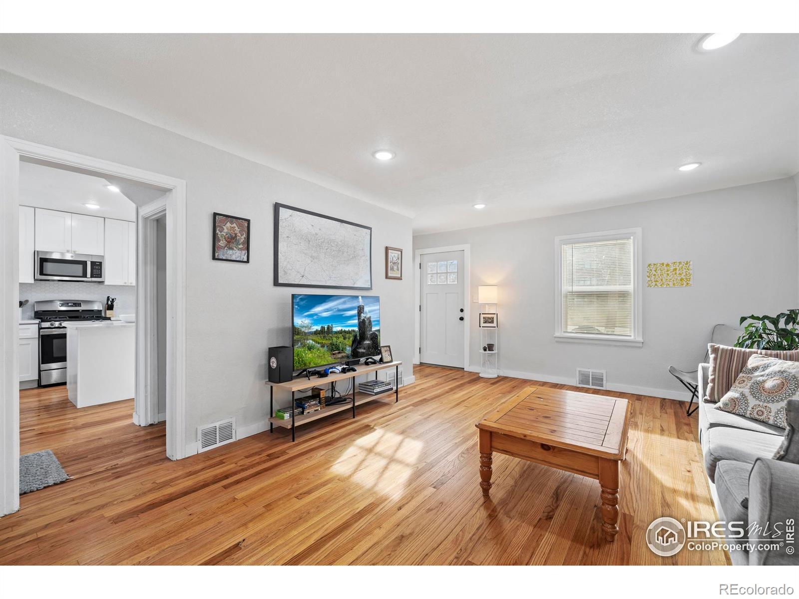 814 West Laurel Street Fort Collins, CO 80521 - Photo 9 of 35 a living room with furniture and a flat screen tv