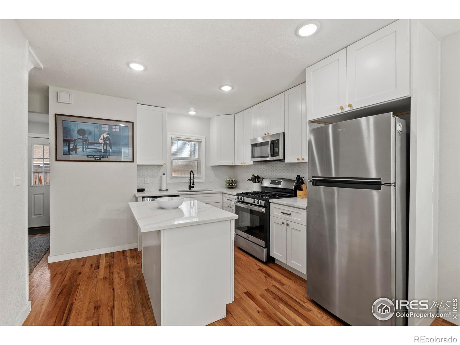 814 West Laurel Street Fort Collins, CO 80521 - Photo 10 of 35 a kitchen with refrigerator cabinets and a sink
