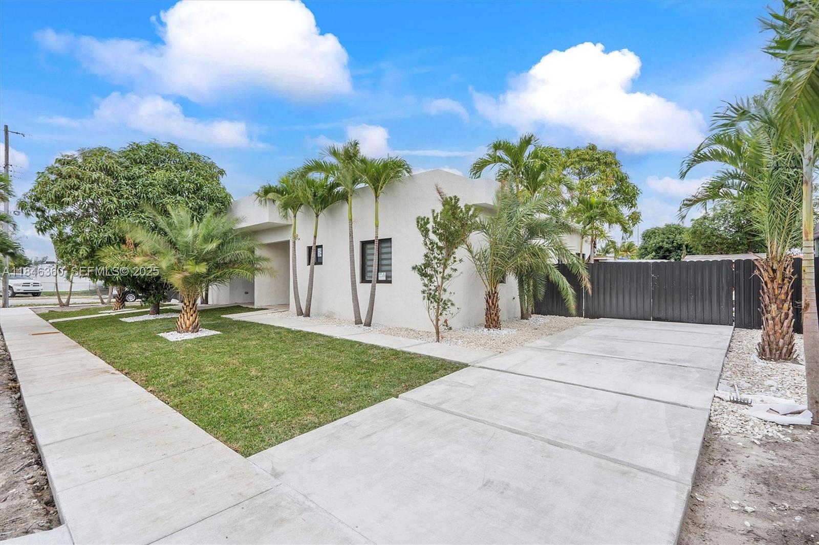 501 East 59th Street Hialeah, FL 33013 - Photo 1 of 29 front view of a house with a yard and potted plants