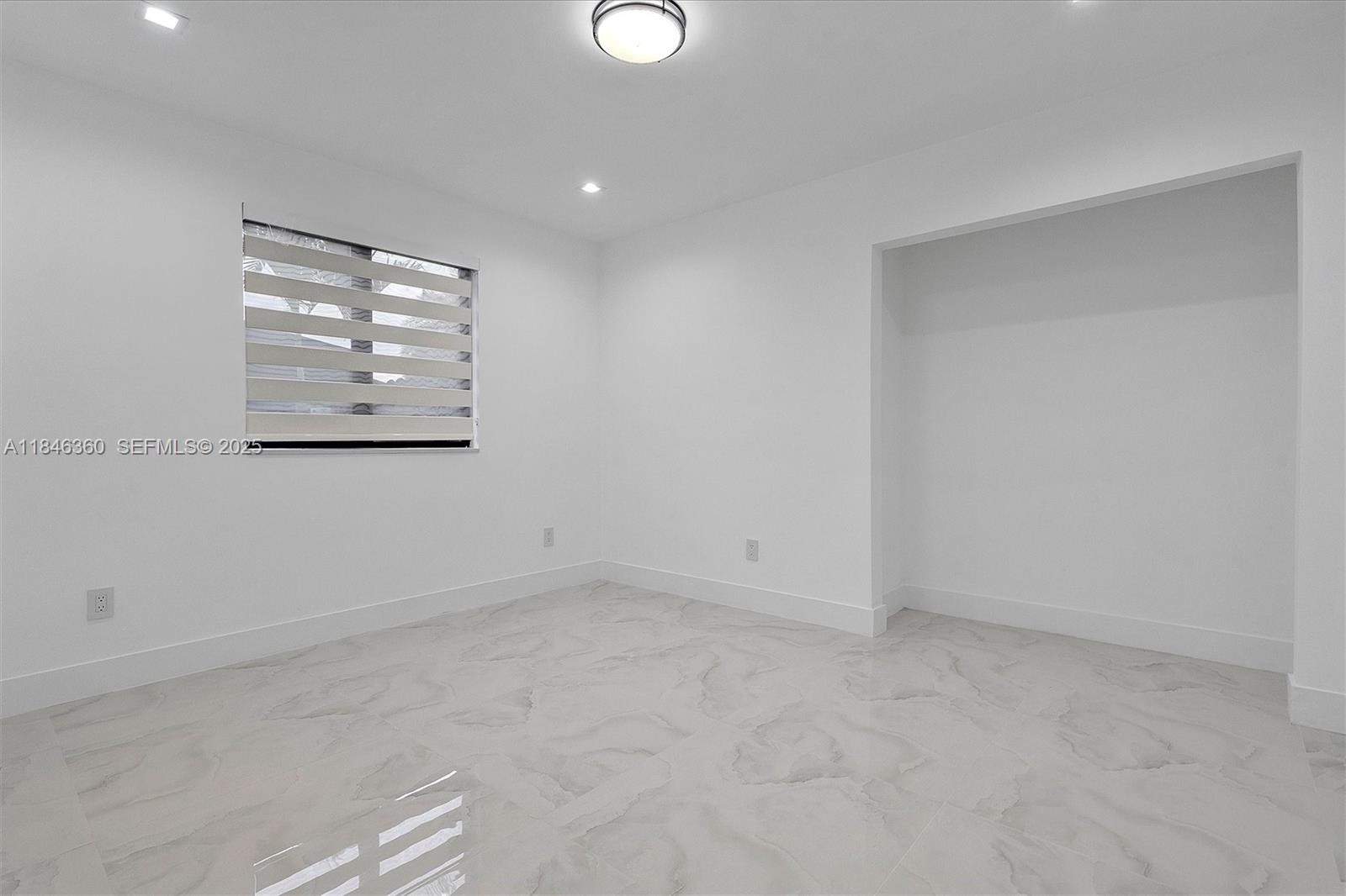 501 East 59th Street Hialeah, FL 33013 - Photo 17 of 29 an empty room with windows