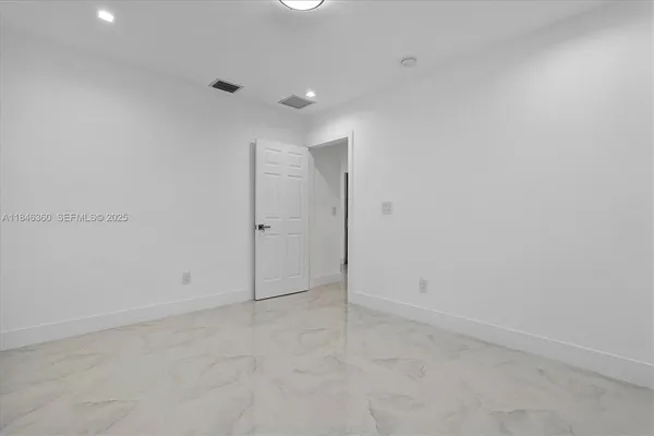 en empty room with windows