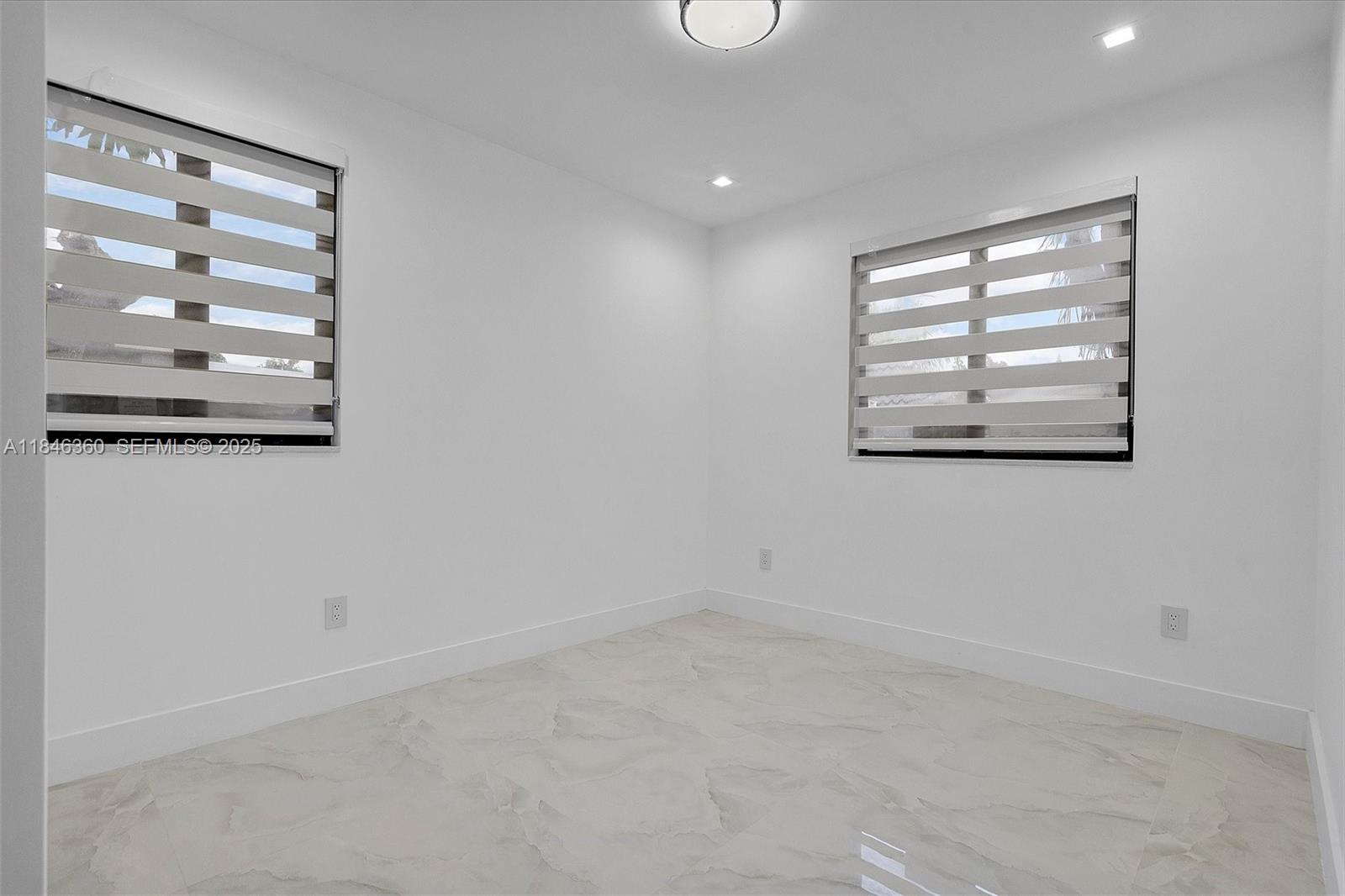 501 East 59th Street Hialeah, FL 33013 - Photo 19 of 29 en empty room with windows