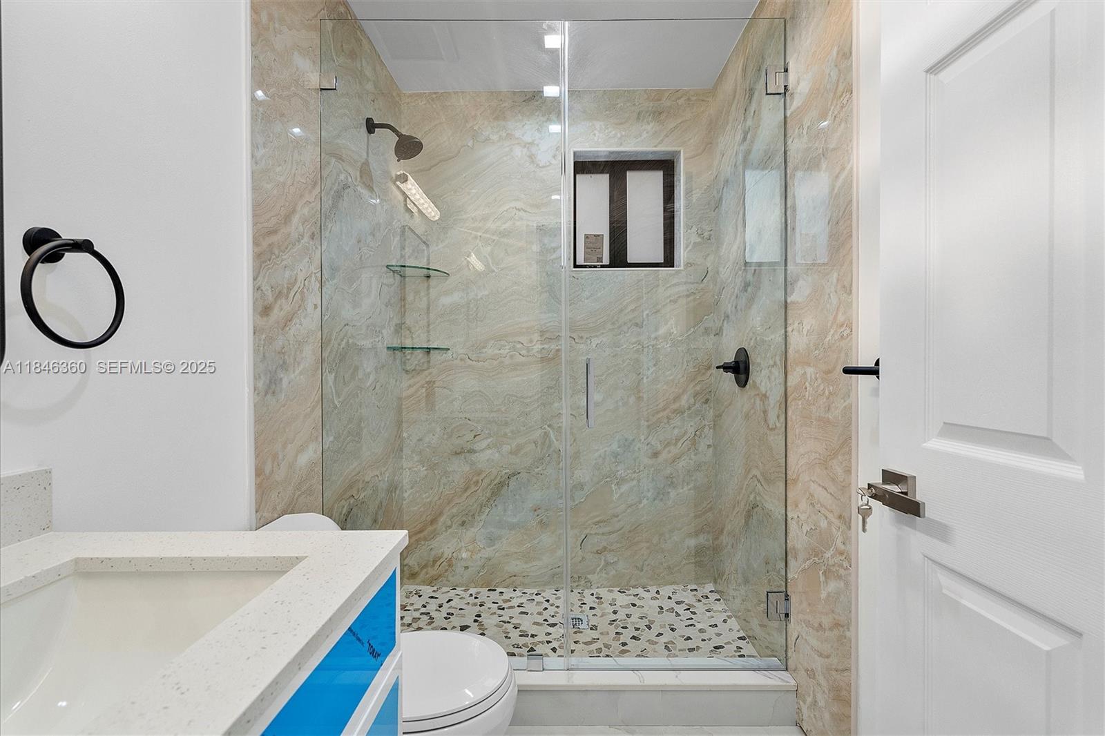 501 East 59th Street Hialeah, FL 33013 - Photo 22 of 29 a bathroom with a sink a toilet and shower