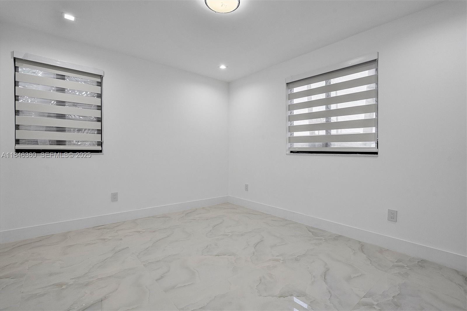 501 East 59th Street Hialeah, FL 33013 - Photo 23 of 29 an empty room with windows