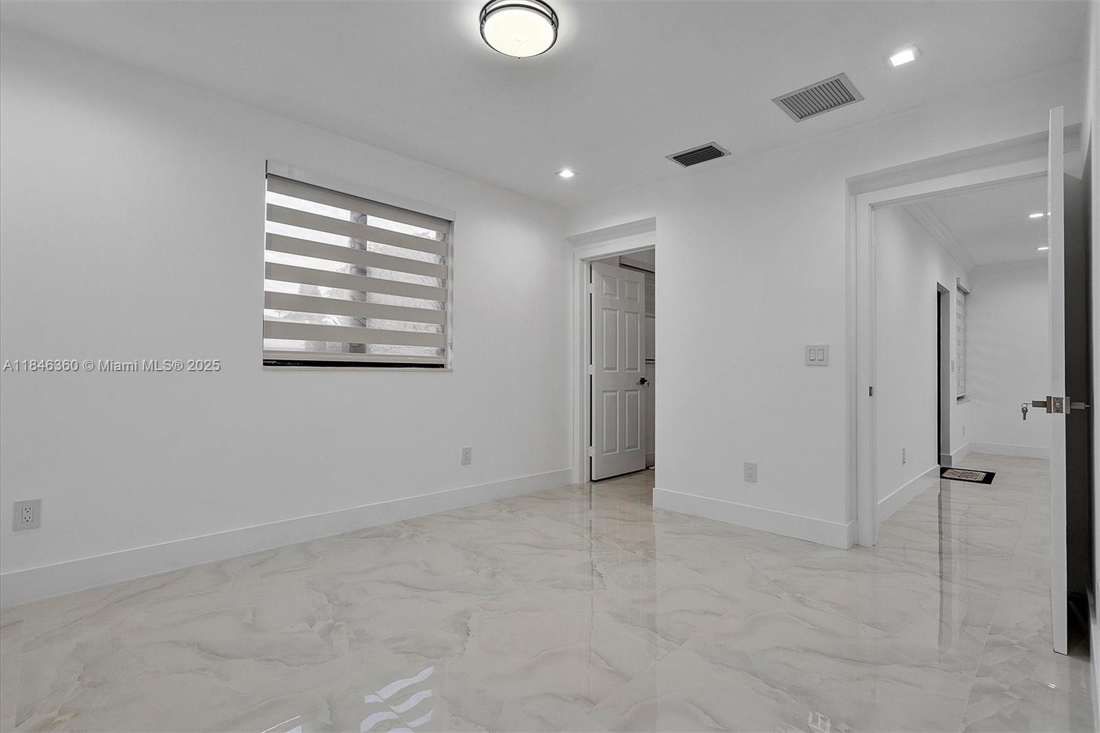 501 East 59th Street Hialeah, FL 33013 - Photo 25 of 29 a view of an empty room with a window