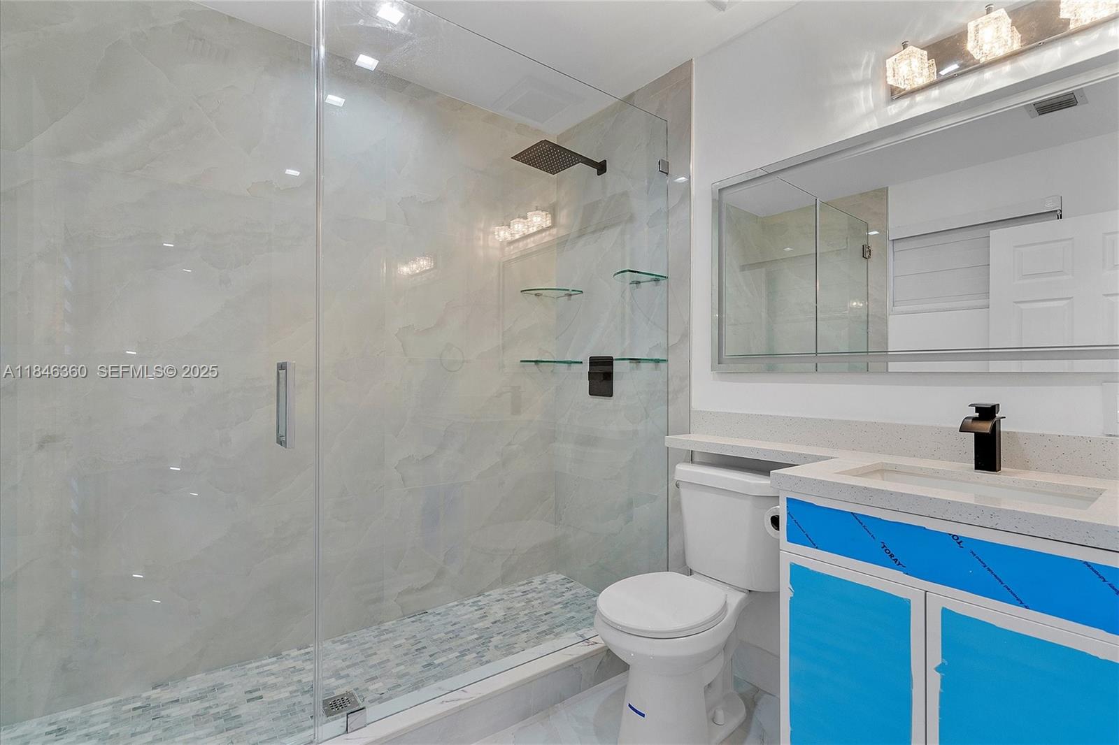 501 East 59th Street Hialeah, FL 33013 - Photo 26 of 29 a bathroom with a sink a toilet and shower