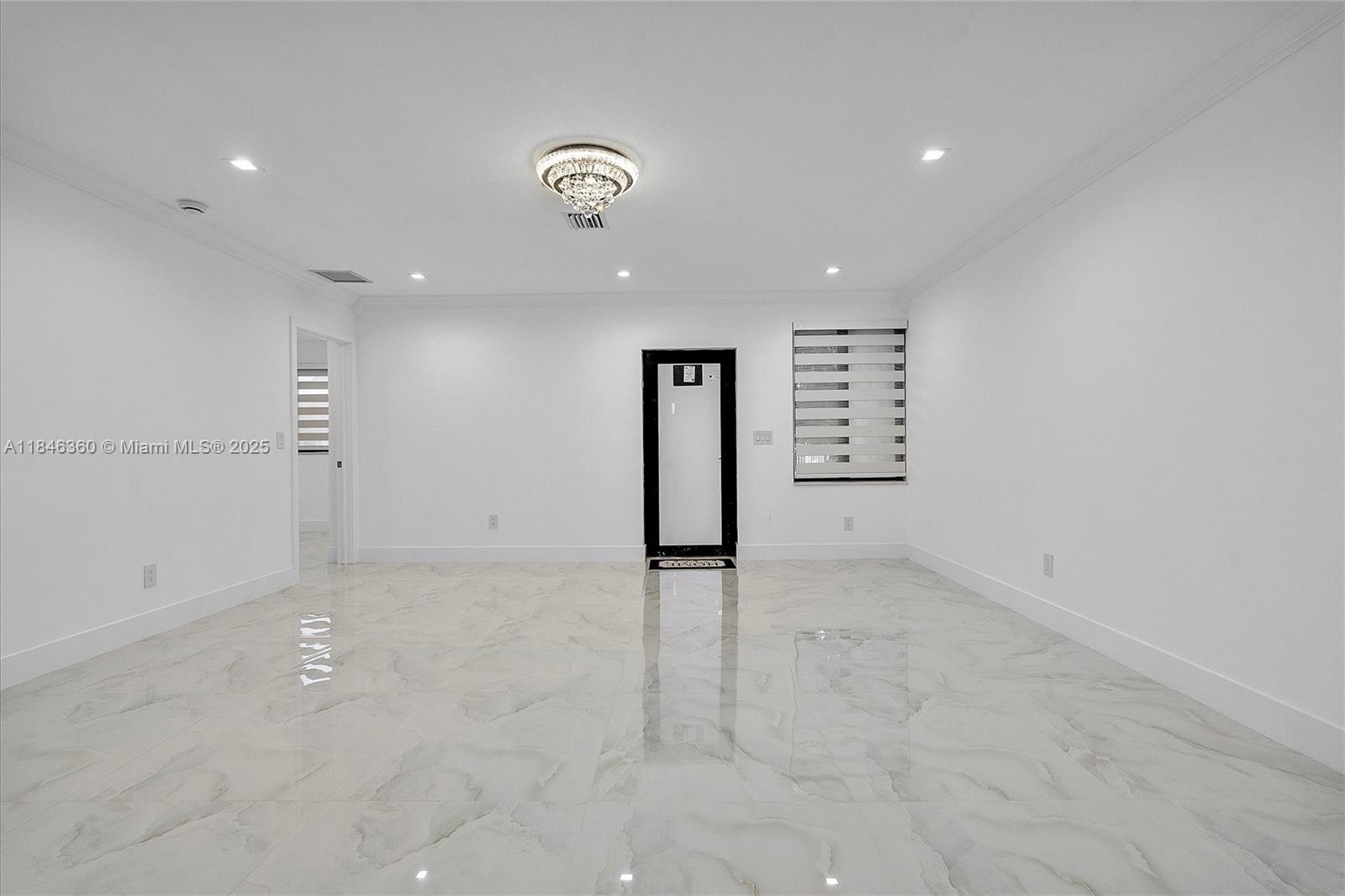 501 East 59th Street Hialeah, FL 33013 - Photo 28 of 29 an empty room with entrance and stairs