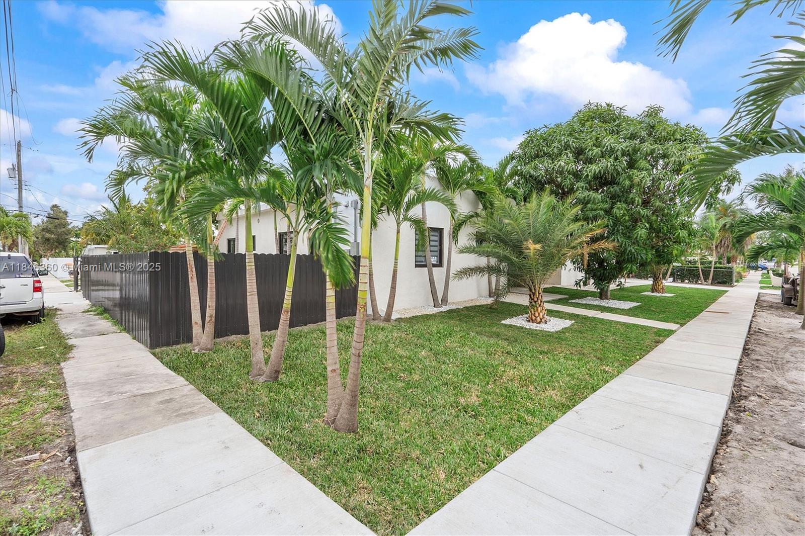 501 East 59th Street Hialeah, FL 33013 - Photo 4 of 29 a view of a yard with plants and a fountain