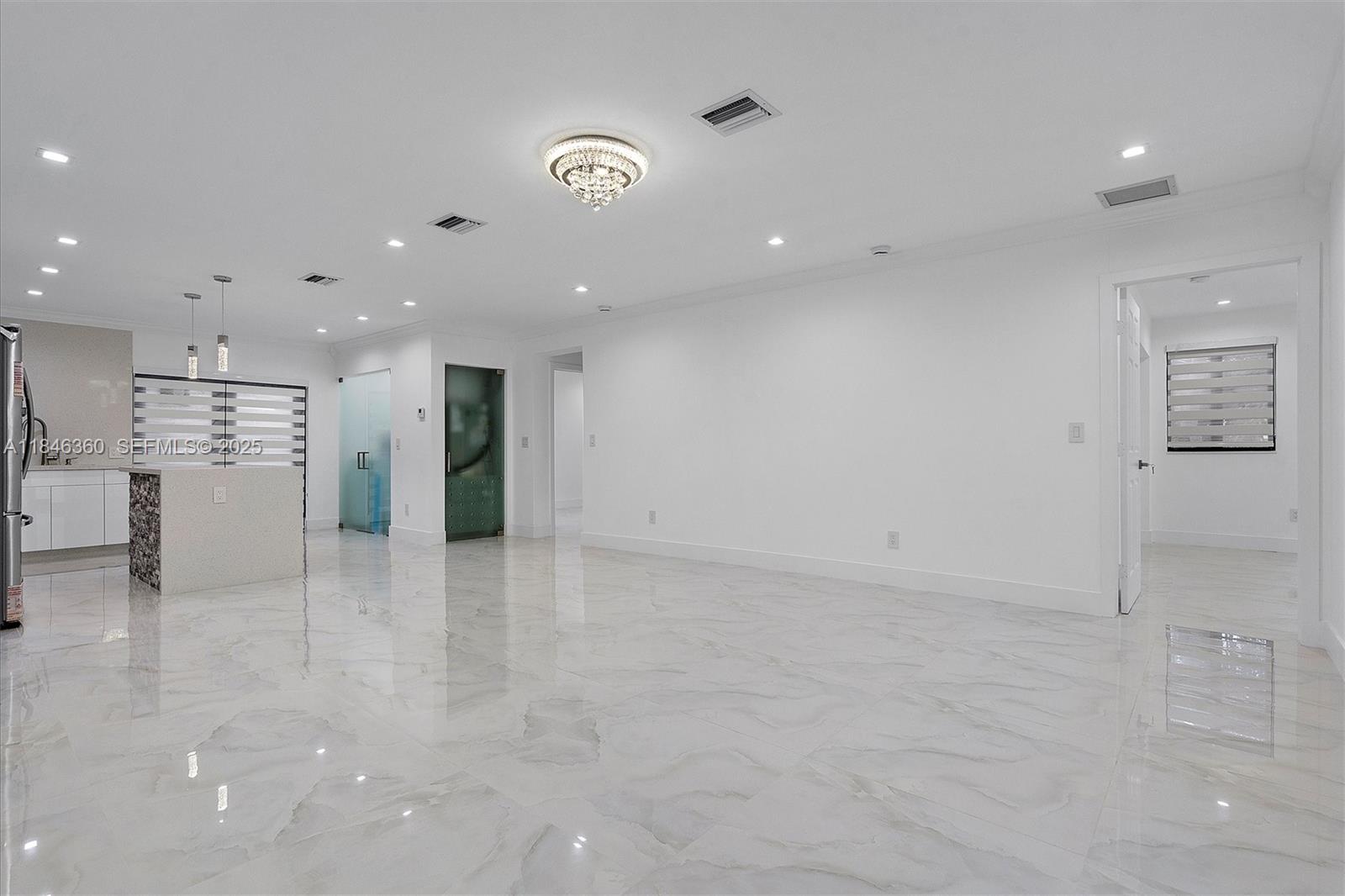 501 East 59th Street Hialeah, FL 33013 - Photo 5 of 29 a view of kitchen with refrigerator and window