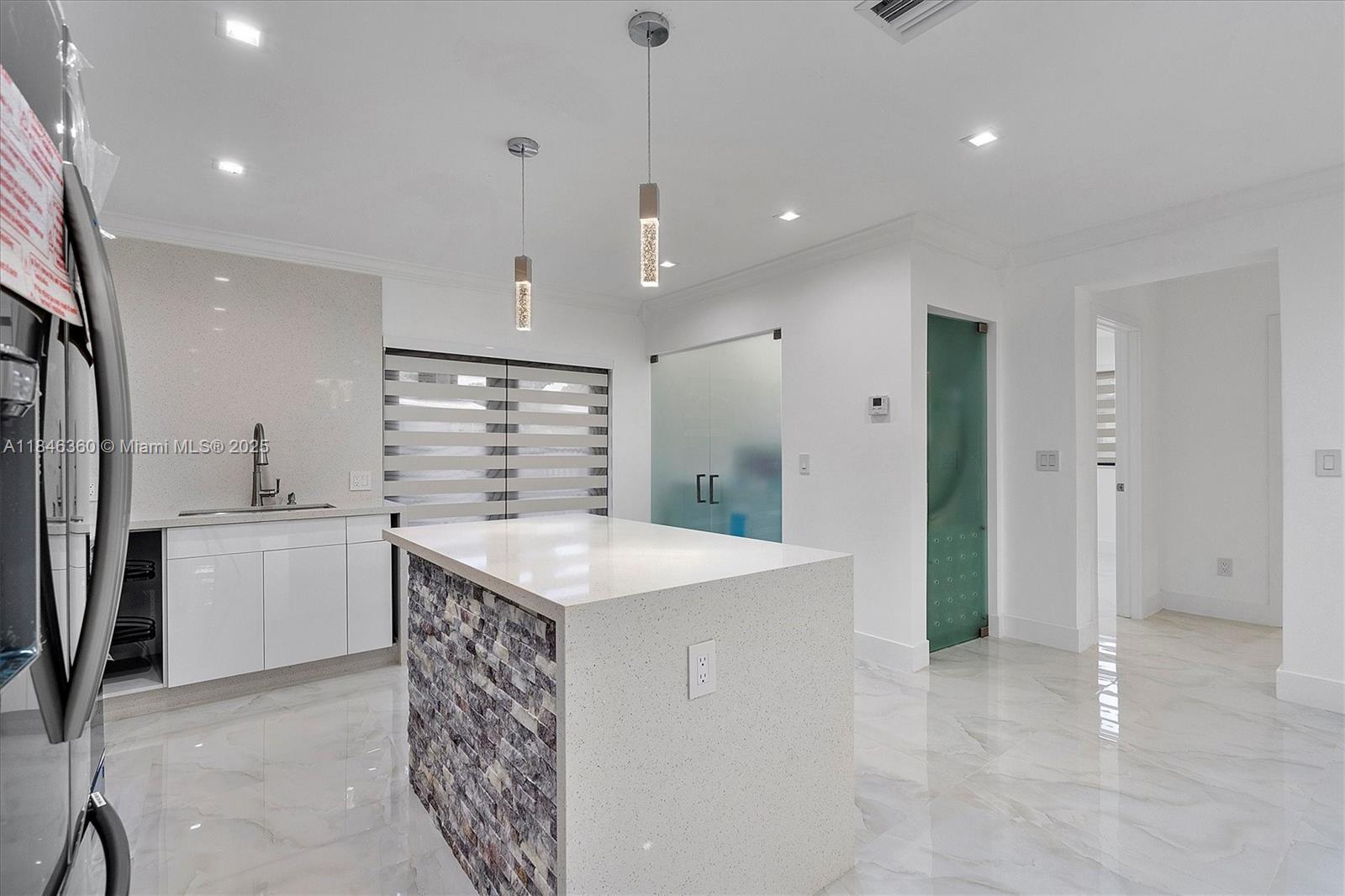 501 East 59th Street Hialeah, FL 33013 - Photo 10 of 29 a kitchen with kitchen island a sink stainless steel appliances and cabinets