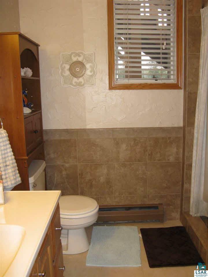 5540 Koenen Road South Range, WI 54874 - Photo 18 of 25 Lower level updated bath features nice tile work.
