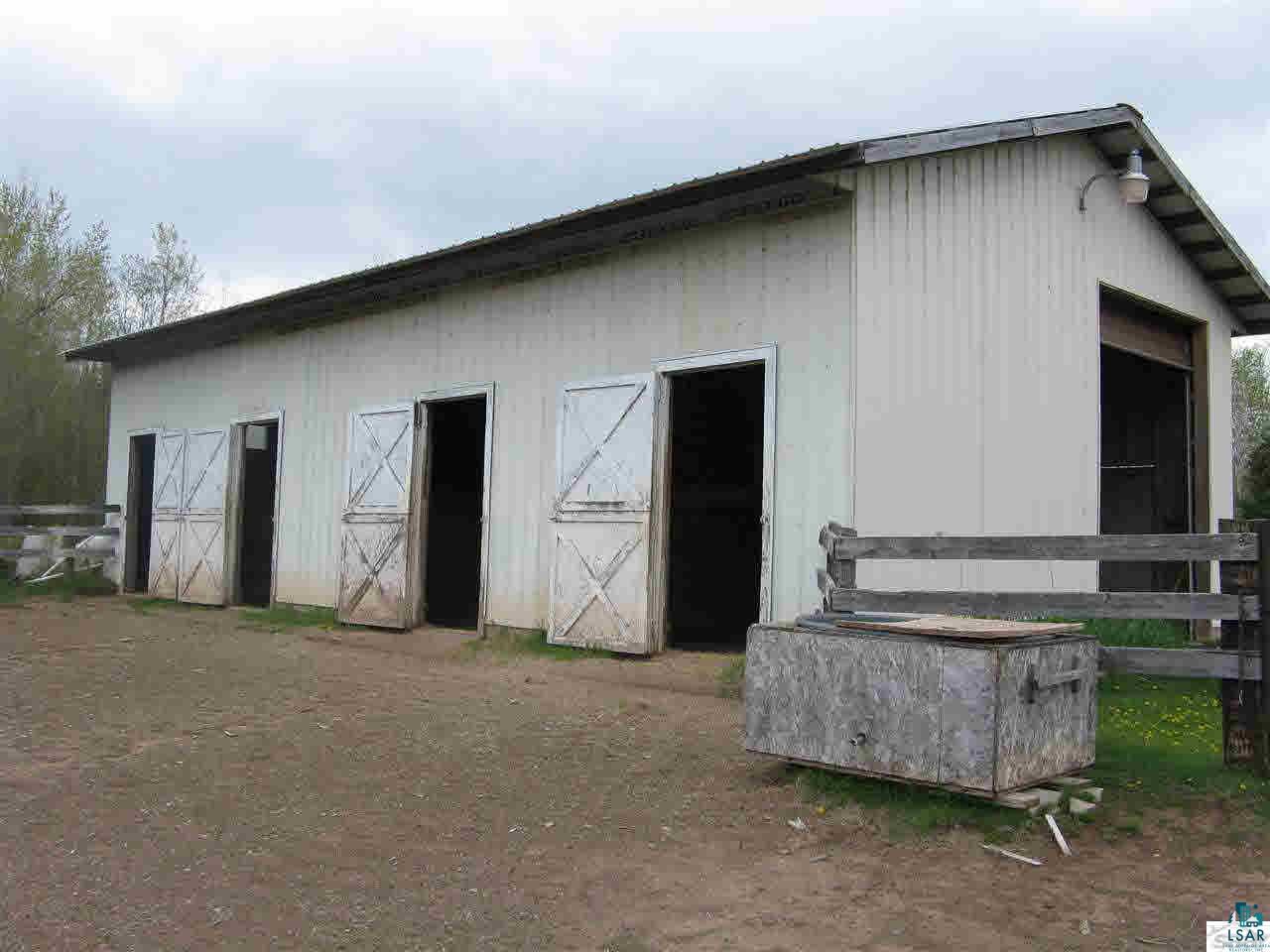 5540 Koenen Road South Range, WI 54874 - Photo 24 of 25 Four stall barn with storage also. Could pull the stalls and convert into a garage.