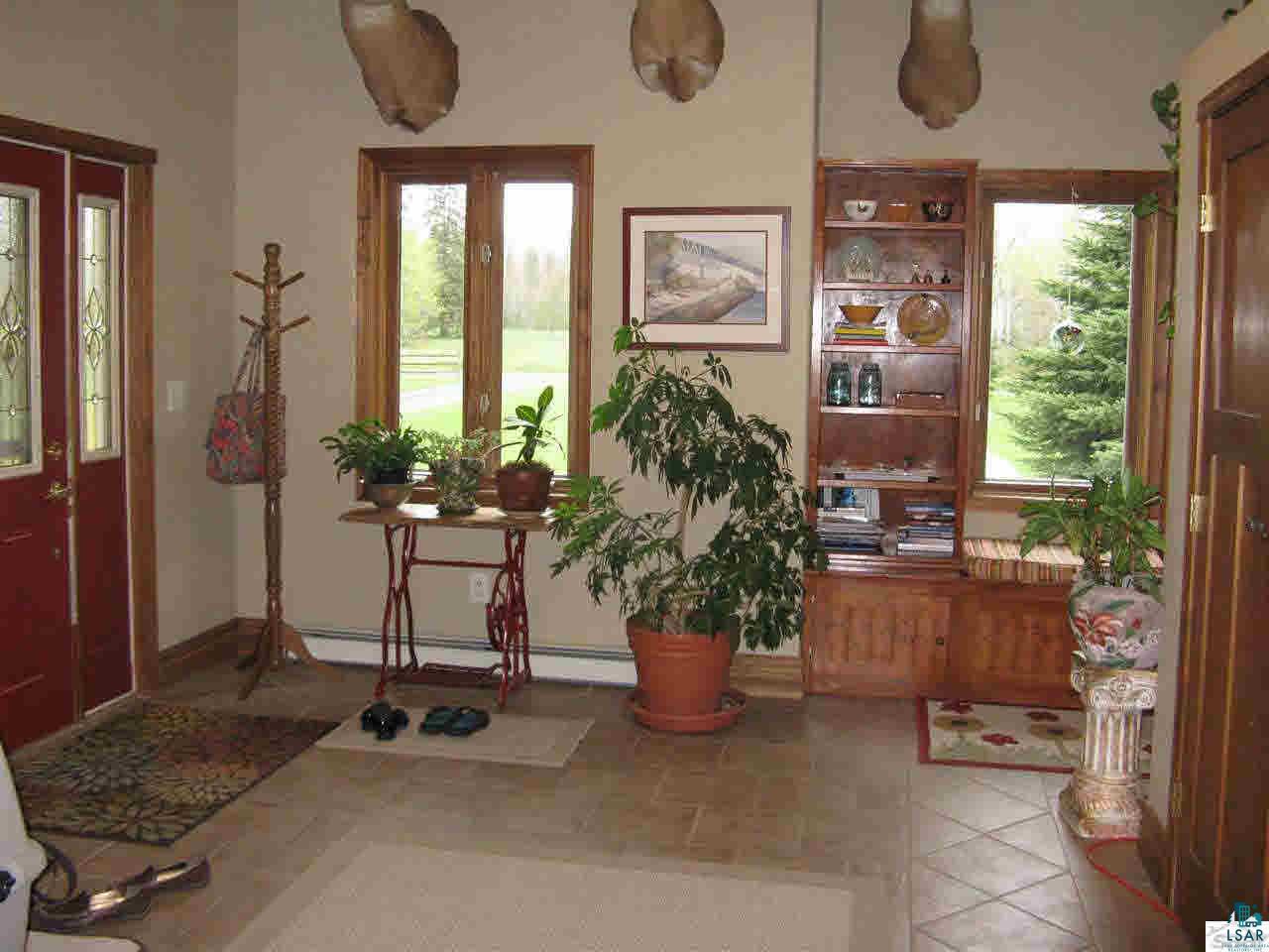 5540 Koenen Road South Range, WI 54874 - Photo 4 of 25 Entry has tiled floor for easy maintenance and a reading nook for those quiet times.