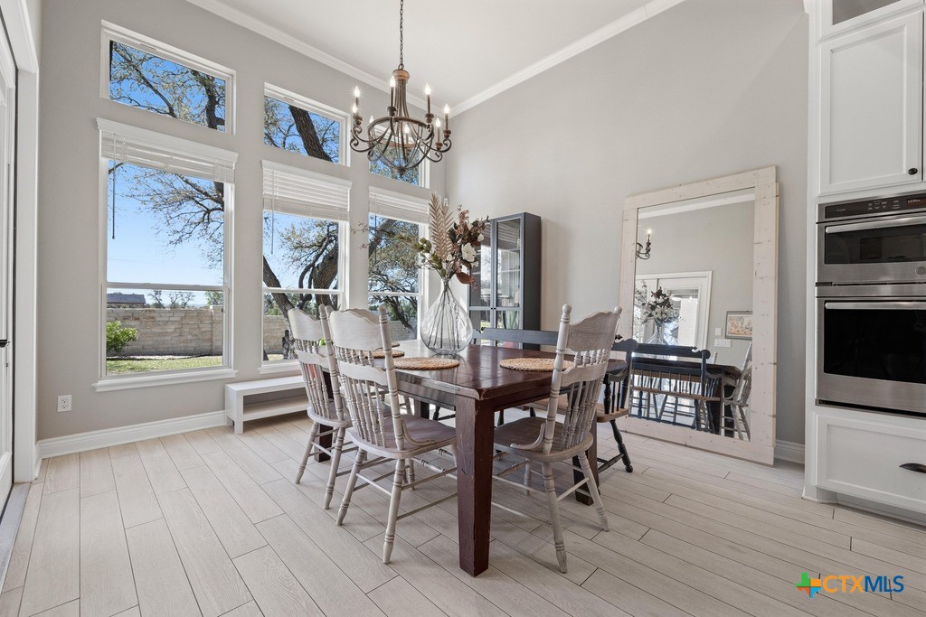 1745 Alta Vista Loop Temple, TX 76502 - Photo 16 of 34 a view of a dining room with furniture window and wooden floor