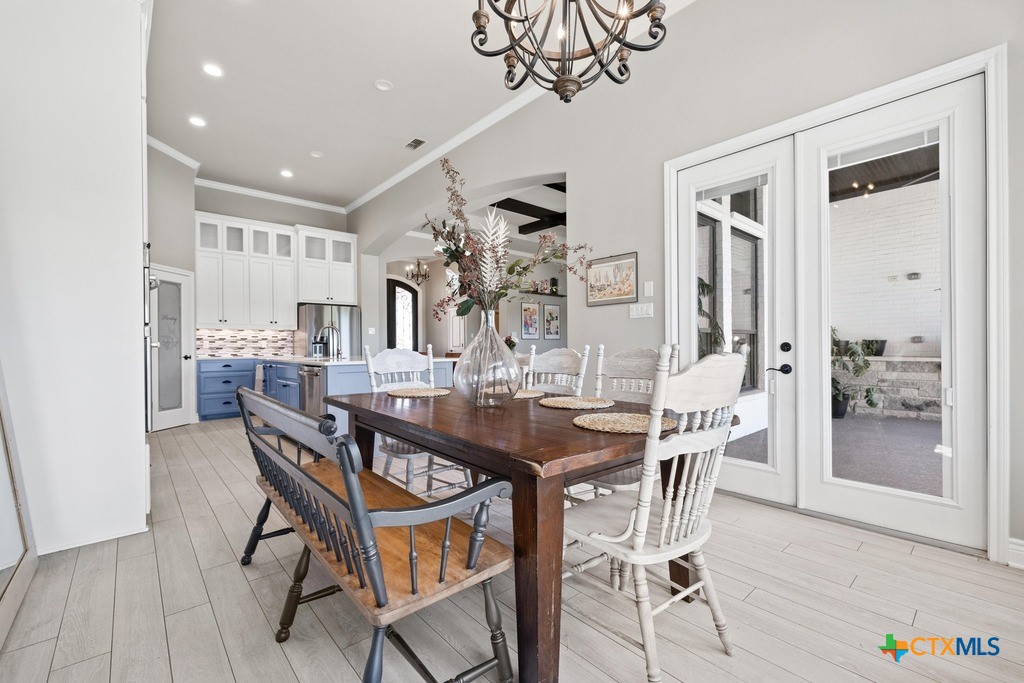 1745 Alta Vista Loop Temple, TX 76502 - Photo 17 of 34 a view of a dining room with furniture and a chandelier