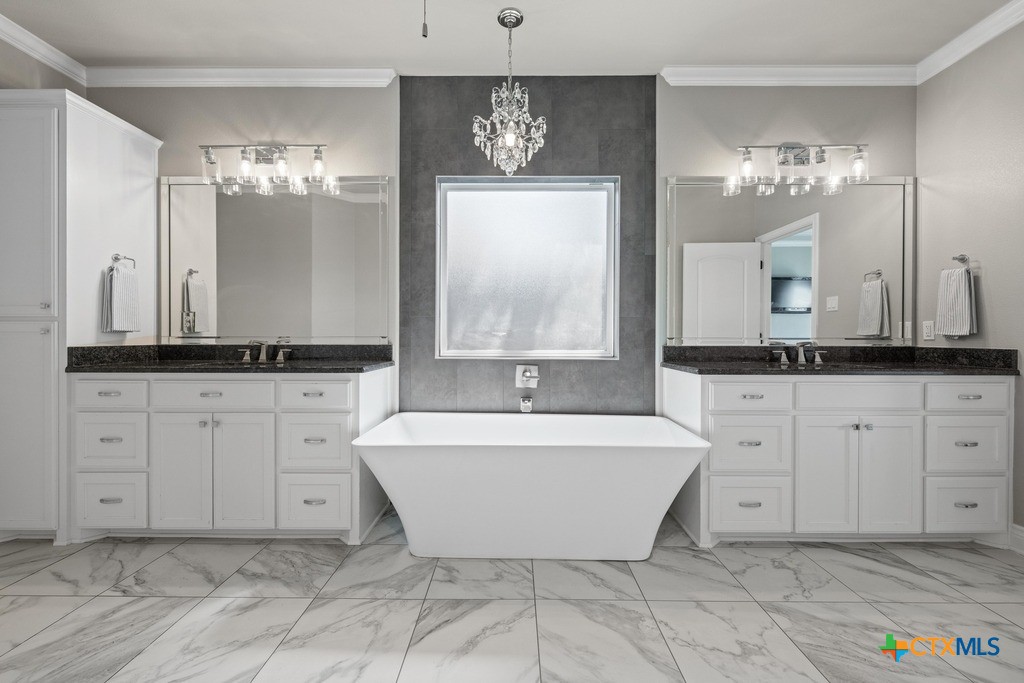 1745 Alta Vista Loop Temple, TX 76502 - Photo 20 of 34 a spacious bathroom with a double vanity sink mirror and bathtub
