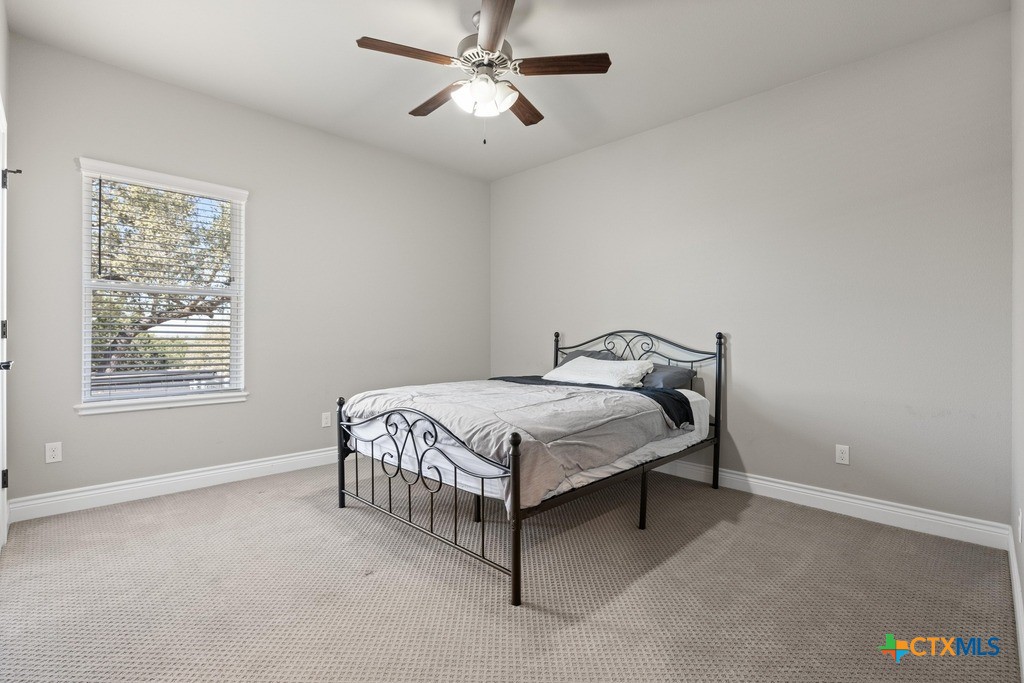 1745 Alta Vista Loop Temple, TX 76502 - Photo 24 of 34 a bed sitting in a bedroom next to a window