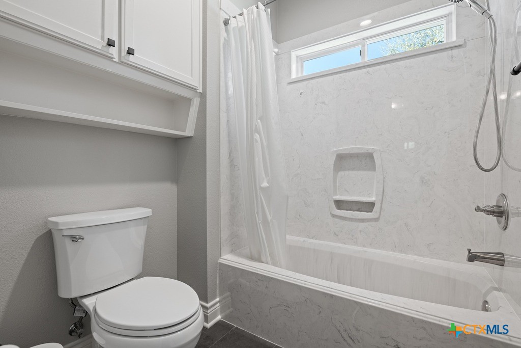 1745 Alta Vista Loop Temple, TX 76502 - Photo 25 of 34 a white toilet sitting next to a bath tub