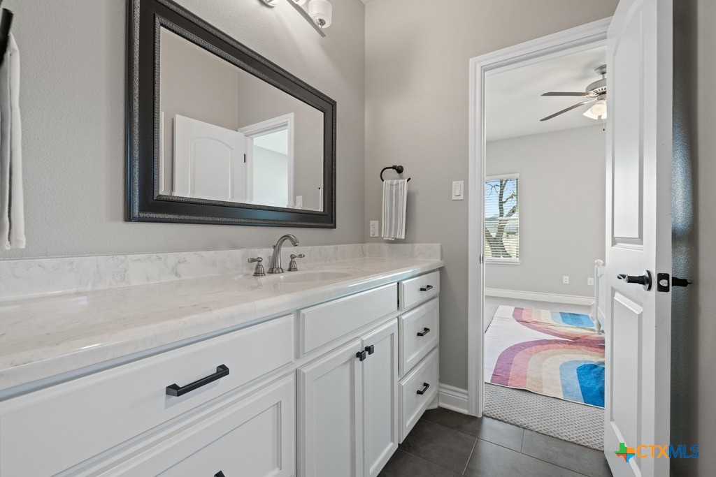1745 Alta Vista Loop Temple, TX 76502 - Photo 26 of 34 a bathroom with a double vanity sink mirror and