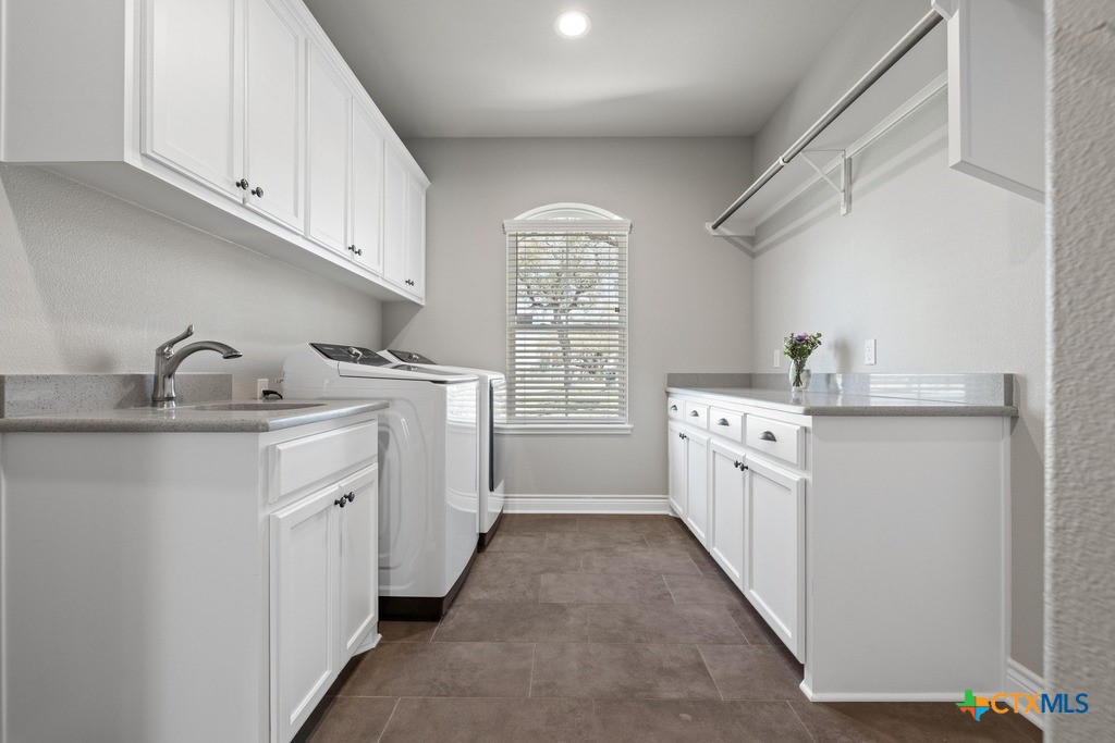 1745 Alta Vista Loop Temple, TX 76502 - Photo 29 of 34 a kitchen with window a sink and cabinets