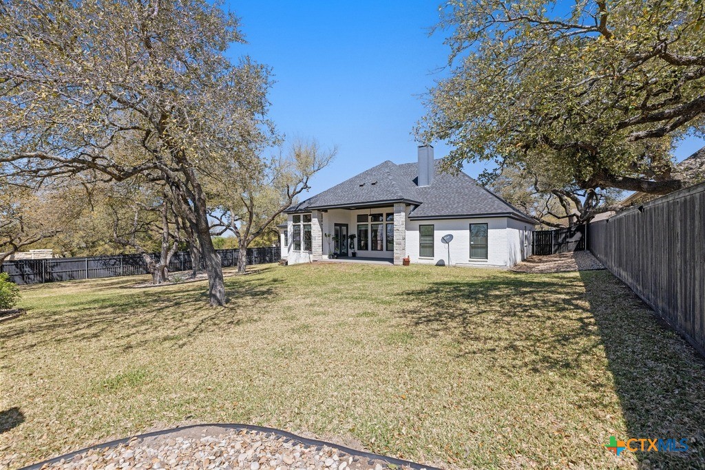 1745 Alta Vista Loop Temple, TX 76502 - Photo 31 of 34 a view of a yard in front of a house with a large tree