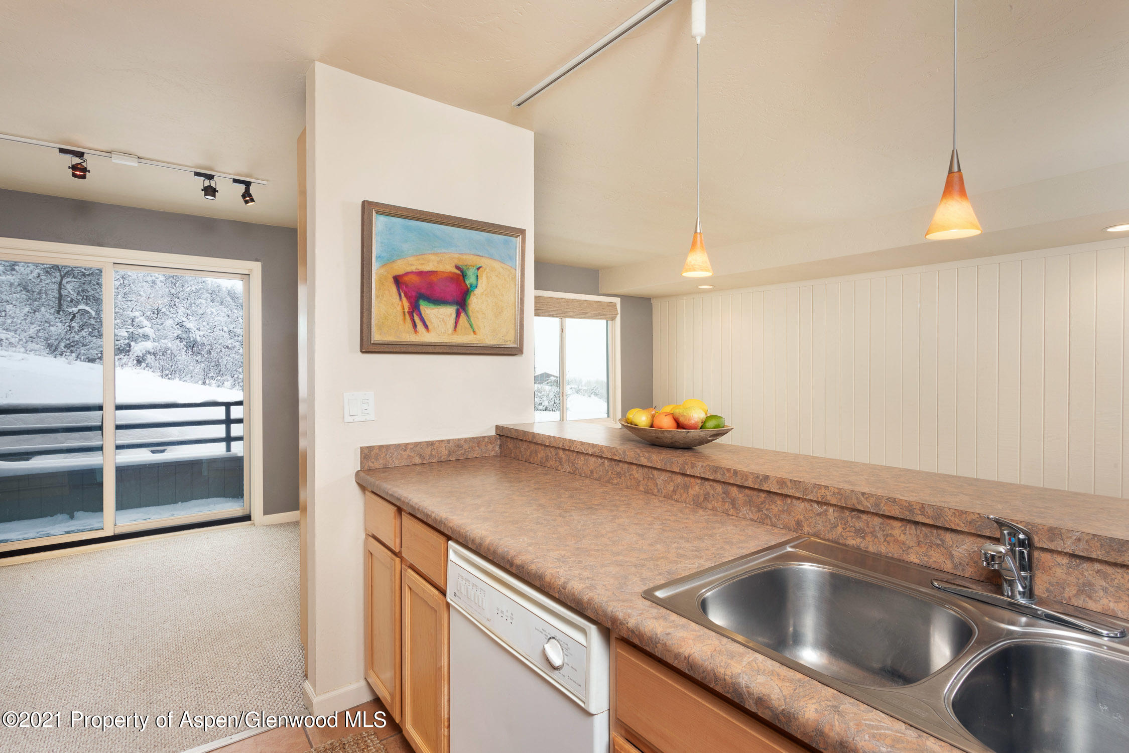35 Lower Woodbridge Road, Unit 155 Snowmass Village, CO 81615 - Photo 5 of 14 a kitchen with a sink and a stove top oven